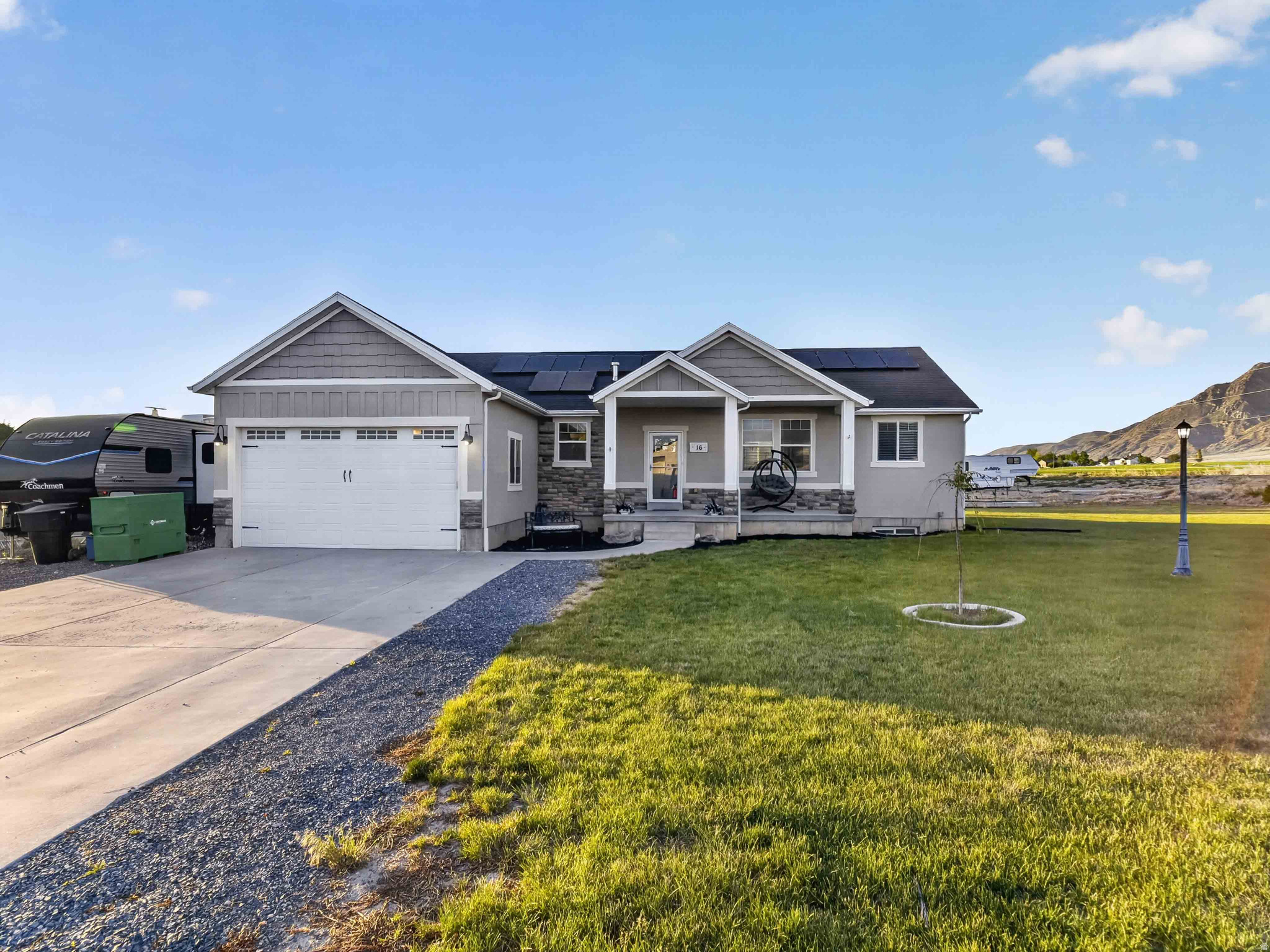 **Open House Friday, June 5th between 5:30 pm & 8:00 pm** Enjoy rural freedom and modern comfort in the wide open spaces of Mona, Utah! This stylish rambler sits on a .55 acre lot, with breathtaking panoramic valley and mountain views. Main floor has a stylish open concept kitchen, dining, & family room; convenient laundry & mudroom near the door to the garage; primary suite with dual sinks, separate shower, huge tub & walk-in closet; 2 more bedrooms, & 1 more full bathroom. Double your living space & bring your vision to life in the large unfinished basement. With 2 water heaters, nobody's running out of hot water! Outside, you'll find a 30 amp exterior outlet; tons of parking for trucks, trailers, toys, & equipment (or build a detached garage/workshop); fully-owned solar power; and fiber internet is available. If desired, buyers can negotiate inclusion of the hot tub, AND the chicken coop/fencing, including 17 chickens for continuous farm-fresh eggs.  A true piece of Utah paradise! Schedule your tour today.