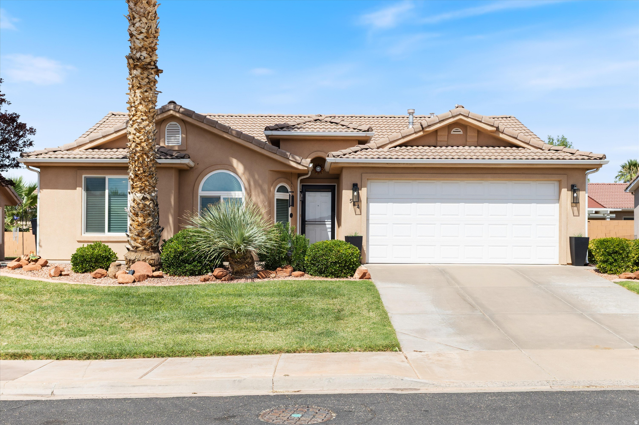 Charming and beautifully maintained home in the desirable Padre Lakes Community! Featuring 3 bedrooms and 2 baths, this darling home offers newly installed light-toned engineered flooring, fresh paint, updated light fixtures, new kitchen appliances, and a newer water heater. Enjoy spectacular views from the front door and a beautifully manicured yard. Perfect for snowbirds escaping Northern Utah winters or for year-round living. Community amenities include a clubhouse, fitness center, indoor pool, hot tub, and pickleball courts.