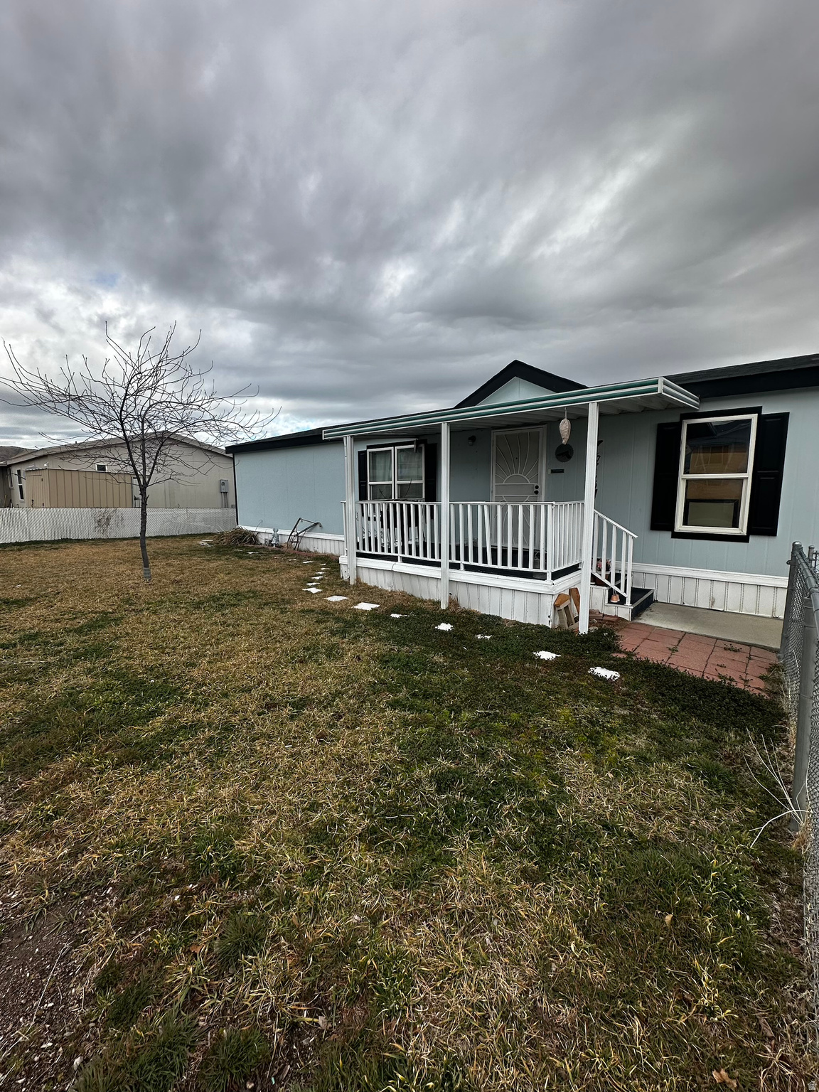This rare double-wide manufactured home in the sought-after Sunset Vista park in Magna is move-in ready and full of charm. The spacious floorplan features a large, sun-filled great room, three bedrooms, and two full bathrooms, all complemented by beautiful hard flooring throughout. With an HOA that includes a community pool, clubhouse, and covers water and trash, this home offers both comfort and convenience in a vibrant, welcoming community.