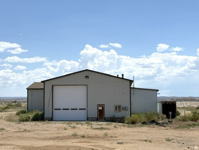 Versatile Industrial shop in Ouray, Utah, designed with trucking and industrial operations in mind. This property features three shop bays, including a drive-through bay large enough to accommodate semi trucks, along with 3-phase power to support a variety of commercial/industrial uses. The electric roll-up doors are 16'x16' with a ceiling height of 18ft. The office area includes two rooms, and bathroom providing space for administrative operations. 5230 Sq.ft. Shop area with a Mezzanine over the approximate 800 Sq.ft. office space. Additional improvements include a septic system, partial perimeter fencing, and a 400-gallon water storage tank for the building. Includes 2 Industrial shop heaters overhead. Conveniently located near the Green River this property offers an excellent setup for a trucking company, contractor, equipment storage, or other business seeking a functional, well-equipped facility. Zoned MG-1 Mining and Grazing which includes Industrial use. Only 4.5 miles from Fantasy Canyon. Buyer to verify the square footage and all provided building information, permitted uses, zoning, and utility availability to their satisfaction.