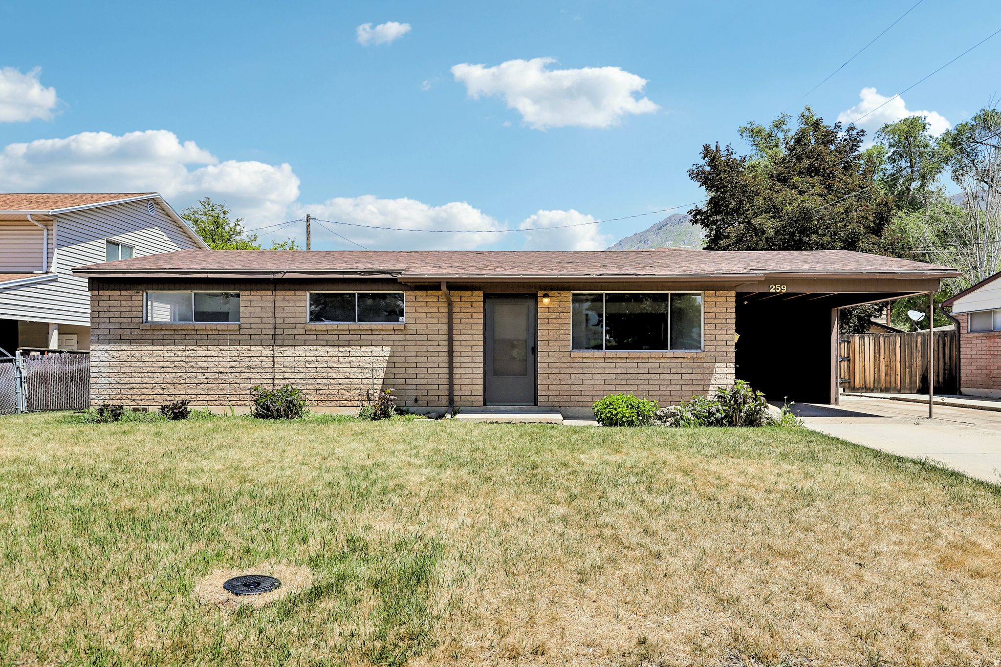 Experience 259 Sage Creek Cir, recently enhanced with fresh interior paint and new flooring throughout the home, creating an updated ambiance. The interior provides a comforting fireplace for warmth. New appliances outfit the kitchen, simplifying daily routines. Beyond, a covered patio overlooks a fenced in backyard, where storage sheds provide practical utility. Discover this updated home, blending comfort with outdoor utility.