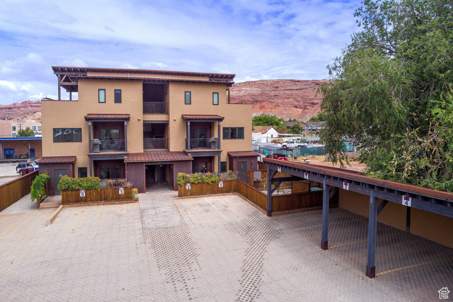 Discover 57 Robbers Roost, Unit #1-a 1,095 sq. ft., 2-bedroom, 2-bath condo in the heart of downtown Moab. This spacious unit is fully turn-key, featuring a full kitchen, washer and dryer, central air, fiber internet, bike storage, BBQ grill, and both covered and uncovered parking. Owners and guests can enjoy shared amenities, including a bike repair station, making it the perfect base for red rock adventures. When you're in Moab, it feels like home; when you're away, offset expenses with the opportunity for short-term rentals. Just steps from local restaurants, shops, bars, and year-round events, this property offers the best of convenience and comfort.