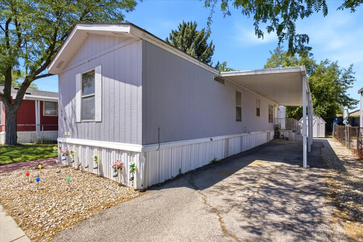 Welcome to this well-maintained 3 bedroom, 1 bathroom manufactured home in the beautiful Meadowbrook community!  In combination with an accessible layout, this home features central AC, mature fruit trees, fresh paint, and a newer water heater (2024).  The extra storage room was previously a bathroom, and could easily be converted back if desired.  Close proximity to I-15, Valley Fair Mall, and the Maverik Center.  Community amenities include a splash pad, sports court, and clubhouse to host any and all events!  Please reach out to the listing agent if you need any referrals for lending on manufactured homes - schedule your showing today!   Square footage figures are provided as a courtesy estimate only, and buyer is advised to obtain an independent measurement to verify square footage.  Buyer & Buyer's Agent to verify all listing information.