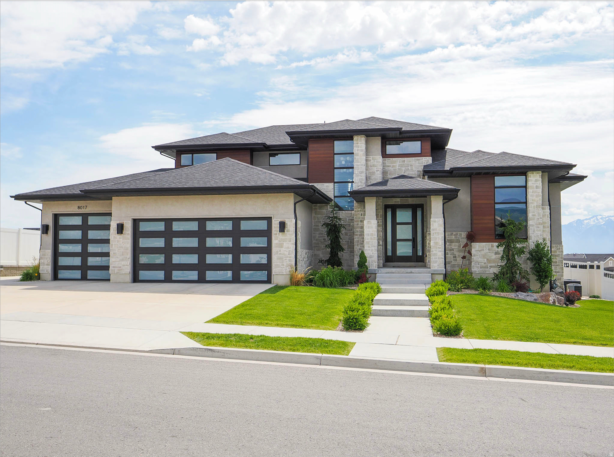This parade home built by Symphony is a must see, and priced to sell. Newly added cabinetry to the mudroom and office is ideal for storage. Additional upgrades include RV pad, basketball hoop, outdoor kitchen, built in gas firepit, water softener, roller shades, and garage shelving. Located in a superb community with a park, bike path, and a pool next door to the home. The pool location is so convenient, it makes the summer a blast. This home has a stunning modern exterior with glass panel garage doors. The fully finished 4 car garage (3 car and deep tandem) features ceiling storage and epoxy floors, as well as a 240V outlet. As you walk in you're welcomed by a stunning catwalk with modern railing, open to the great room with a 2 story concrete fireplace. The large den/office has 14' ceilings and beautiful new cabinetry with a fully tiled accent wall. Warm engineered hardwood floors compliment the modern elements perfectly. Massive waterfall island open to the great room provides the perfect entertaining flow. Large pantry and dining nook. The dining nook opens up to the covered patio. The outdoor kitchen is sleek, modern concrete and honed black granite countertops. Off the kitchen is the mudroom with 5 large custom cabinet mudroom lockers. A newly upgraded powder bath features a viola marble sink and tiled walls. The primary suite on the opposite side of the home boasts 10' ceilings, a walk in shower, and large walk in closet. Square footage is pulled from a previous appraisal, buyer to verify. Pre approval or proof of funds required to show.
