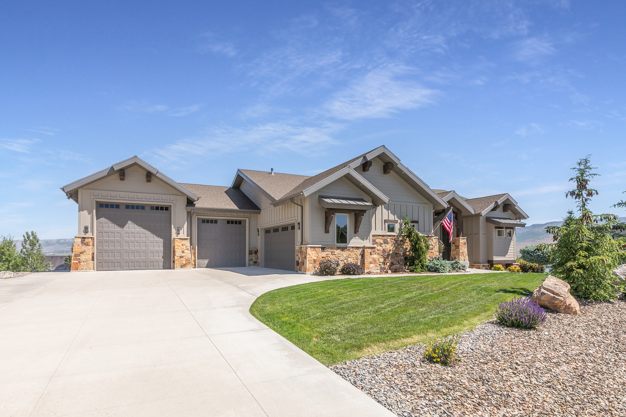 Experience the Best of Ogden Valley Living! Perched to capture breathtaking panoramic views of the entire Ogden Valley and the sparkling blue waters of Pineview Reservoir, this exceptional custom home offers a lifestyle unlike any other. Enjoy world-class recreation just minutes from your doorstep, including hiking and biking trails, ski resorts, a championship golf course, and two scenic reservoirs.  The moment you enter, you'll be captivated by stunning lake and mountain views highlighted by unforgettable sunsets. The thoughtfully designed floor plan features 4 spacious bedrooms, each with its own walk-in closet, and 4 beautifully finished bathrooms. The main level showcases a grand great room, custom gourmet kitchen, and an oversized covered deck perfectly positioned to take in the incredible scenery. The walkout lower level is designed for entertaining, featuring a second great room with a sunken theater area, large kitchenette, half bath, and direct access to a covered patio. Just beyond, you'll find a beautifully crafted flagstone patio with a massive gas fire pit, creating the perfect setting to relax, entertain, and enjoy the breathtaking reservoir and mountain views. Car enthusiasts, hobbyists, and outdoor adventurers will love the nearly 3,000 square feet of heated garage and storage space. The main garage includes two 225-amp plugs, a ski locker, and a half bath, while the lower garage offers over 1,100 square feet of additional space with separate access and endless possibilities. This versatile space has excellent potential for an ADU, mother-in-law apartment, guest quarters, home business, gym, workshop, or additional living space, subject to buyer verification and local approvals. Exquisite woodwork, quality craftsmanship, and beautiful landscaping complete this one-of-a-kind property. If you've been searching for luxury, recreation, and unmatched views in the heart of Ogden Valley, you've found your home. Welcome to Utah mountain living at its finest. Square footage figures are provided as a courtesy estimate only and were obtained from County Records.  Buyer is advised to obtain an independent measurement.