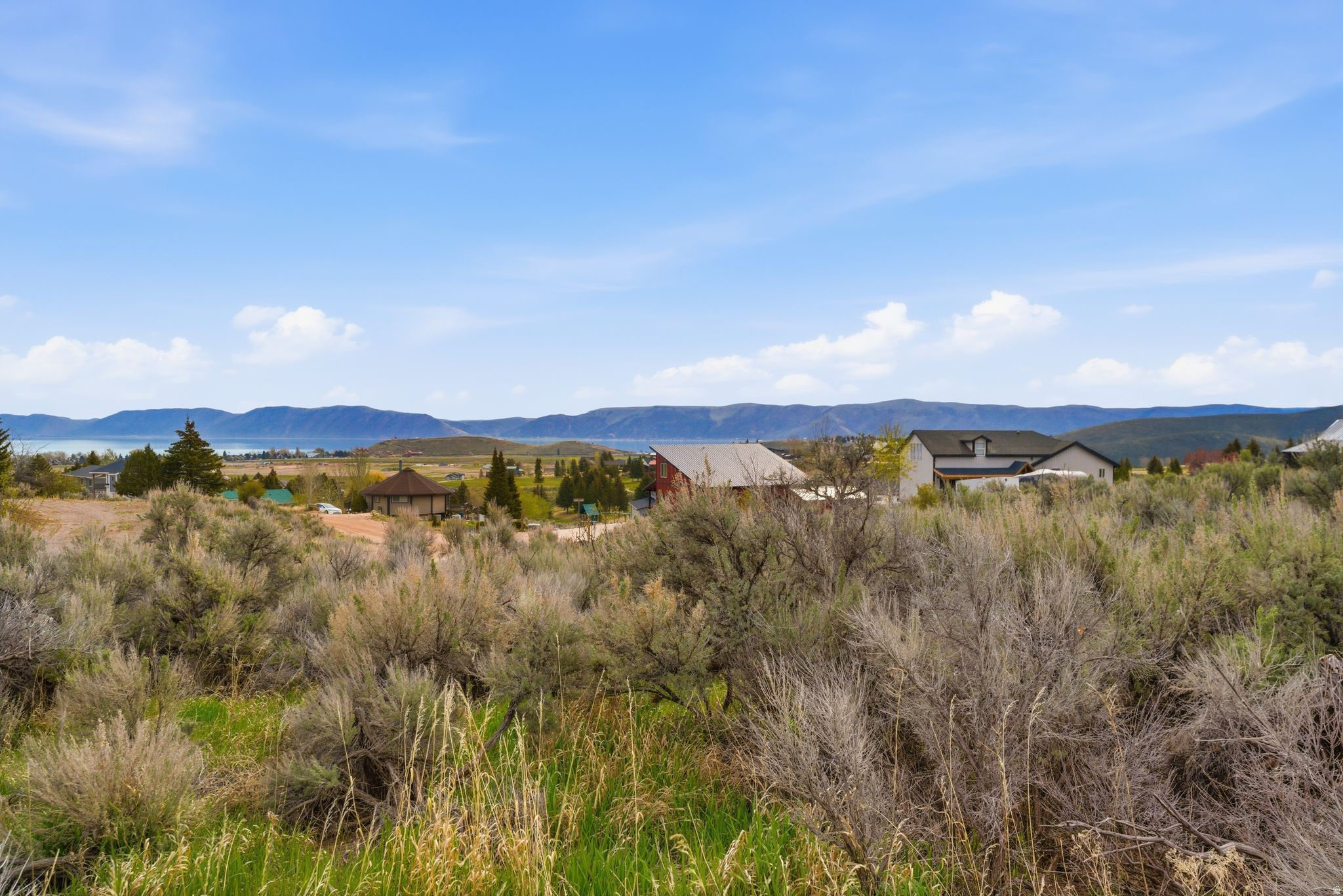 Build-ready lot in a quiet Garden City cul-de-sac. Enjoy beautiful, unobstructed lake views in a private setting. Utilities nearby with access to Ideal Beach and its amenities, plus direct entry to Cache National Forest. Year-round access and short-term rentals are allowed-an excellent opportunity to build your dream home or getaway.