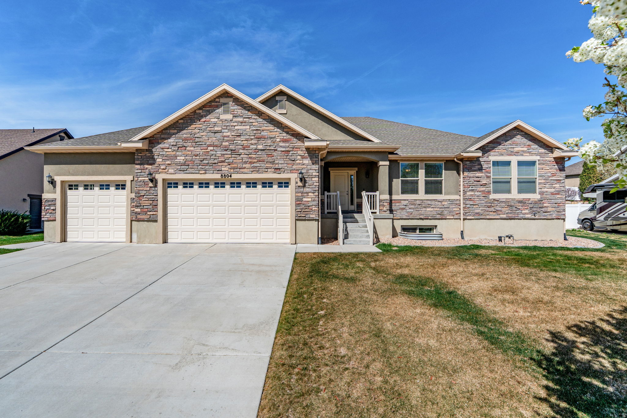 This stunning rambler truly has it all-perfectly located on a quiet cul-de-sac with quick access to I-15 for ultimate convenience. Inside, you'll find a spacious primary suite featuring a luxurious en suite bathroom complete with both a soaking tub and separate shower. The home offers five additional bedrooms and 2.5 more bathrooms, providing plenty of space for family, guests, or a home office setup. Step outside to a beautifully landscaped, tiered backyard with elegant rock walls that create a peaceful outdoor oasis-ideal for relaxing or entertaining. The covered porch can be fully screened in, extending your outdoor living space year-round. Downstairs, enjoy 9-foot basement ceilings, a stylish wet bar, and surround sound-perfect for hosting gatherings or cozy movie nights. The extended-length garage adds an extra 4 feet, accommodating larger vehicles with ease. And to top it all off, the home includes fully paid-off solar, keeping monthly electric costs impressively low. Radon mitigation system also installed in home.