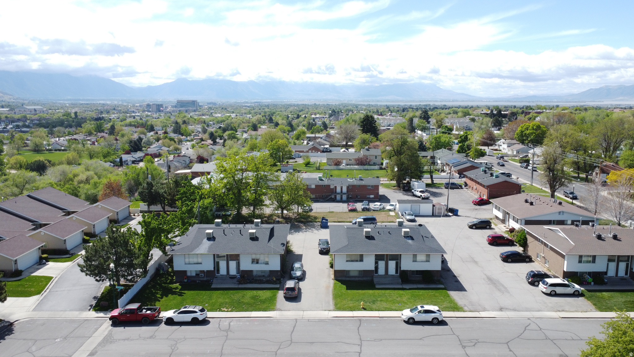 Fantastic investment opportunity in a corridor with very strong rentability for similar units - Excellent location just minutes from UVU, Frontrunner, the University mall, etc. There are two 4-plex properties for sale, side-by-side, and the seller will only sell both together as a package to one buyer. Both roofs were fully replaced in 2024. The owner is a sweet older lady. She has not kept rents "at market" because she has felt bad raising rents or has given discounts for other reasons. Some tenants have been in the property for over 10 years. Some are related to the owner. Conservative pro-forma rents are $1,250/mo for 7 of the units, and $1,350 for the one that has been remodeled (See marketing brochure) - Total of $121,200 Gross Income Potential once all 8 units re-tenanted. All leases expire in June or July, such that the new owner will be able to reposition every unit to a market rent in a very timely fashion and should be a fairly simple process. You will see in the rent roll all the actual rents at the bottom of the MLS listings. See the attached marketing brochure which demonstrates what market rates are. There is an extra land parcel of significant size on the south part of the property  currently a fenced-in grass area. This can potentially be monetized in the future through constructing undercover parking, storage.  One unit was remodeled in 2023 for a family member. The rest have simply been maintained with appliances, carpet, furnaces, paint, etc, as needed. Property is sold as-is. Seller not interested in seller financing. Square footage figures are provided as a courtesy estimate only and are not guaranteed. Buyer is advised to obtain an independent measurement
