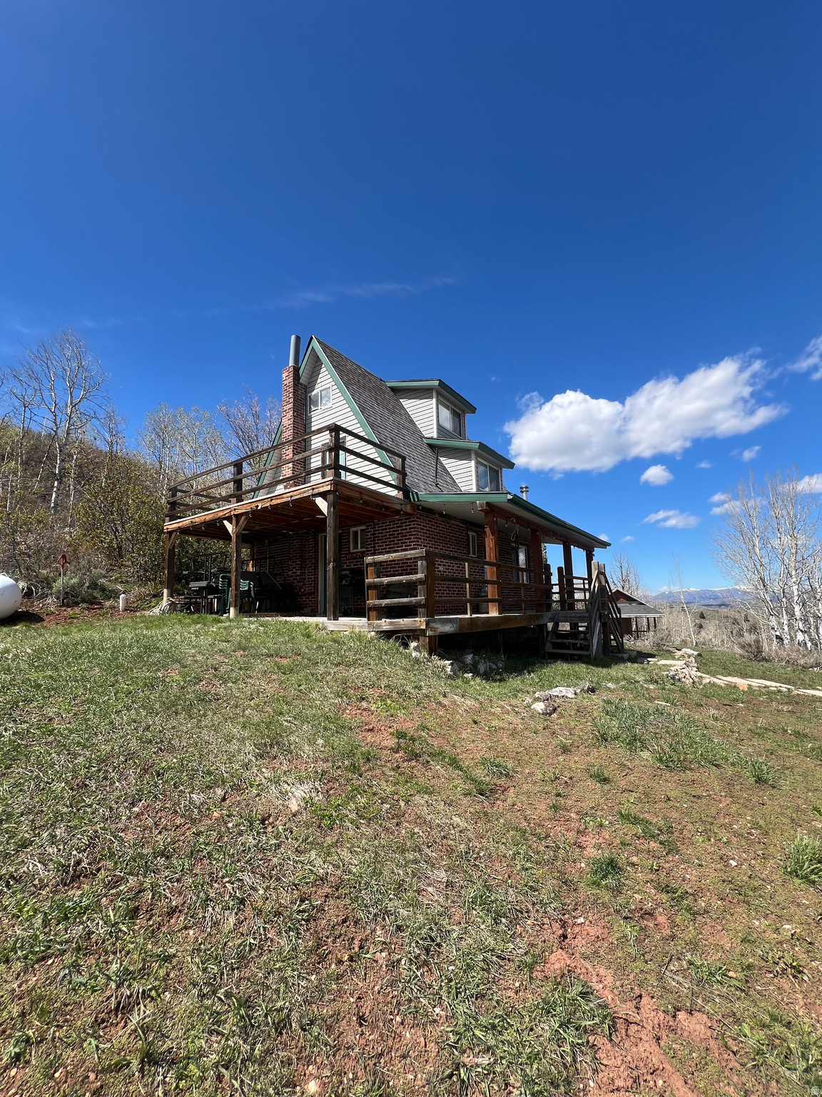 CONSIDERING ALL OFFERS - MAP COORDINATES -  41.5003400748, -111.552683366 3 story hunting/family cabin sitting on beautiful 10 acre lot. The scenery is incredible looking East up a large canyon. From the top of the property looking West is a panoramic view. Deer, Moose, elk. Hunting is allowed with a permit from the association and your hunting license.  Winter fun is had with traveling to the cabin with snowmobiles.  If you live in Cache, Weber Morgan and Box Elder counties, the trip to the cabin is short. Gates are locked. Pineview dam is close. 2 Ski resorts are within a 45 minute drive. The property is located in Monte Cristo Mtn.  THIS WILL BE AN "AS IS SALE".  Square footage figures are provided as a courtesy estimate only and were obtained from tax records.  Buyer is advised to obtain an independent measurement.