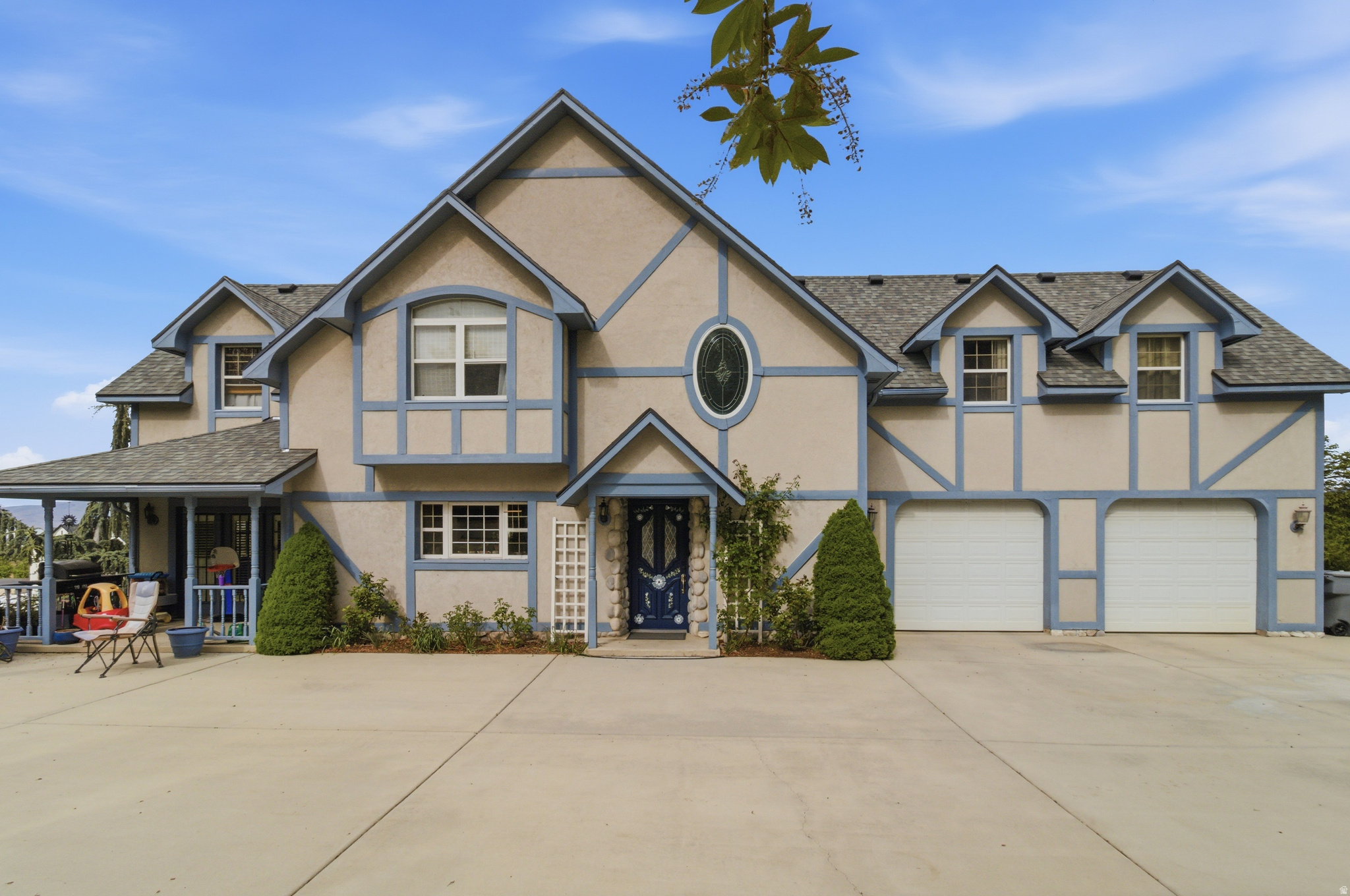 Welcome to this stunning Tudor-style home in Pleasant Grove, set on 2.18 acres near the Murdock Canal Trail. Enjoy privacy, breathtaking valley and mountain views, and a rare combination of beautifully landscaped grounds with additional space full of potential. This home blends timeless charm with modern updates, including a new roof, solar installation, updated flooring, and numerous interior improvements throughout. Features include: 5 bedrooms, including two master suites A 3rd-floor play area Multiple porches and patios to enjoy the surroundings Mature fruit trees (apple, walnut, cherry, apricot) Charming tree-lined driveway The 1,536 sq ft workshop with loft and attached 448 sq ft shed offers endless possibilities for a guest house, studio, or hobby space. Additional highlights include ample parking, RV space, and direct access to the Murdock Canal Trail.  Square footage figures are provided as a courtesy estimate only and were obtained from previous listing.  Buyer is advised to obtain an independent measurement. NO SHOWINGS UNTIL OPEN HOUSE 5/23
