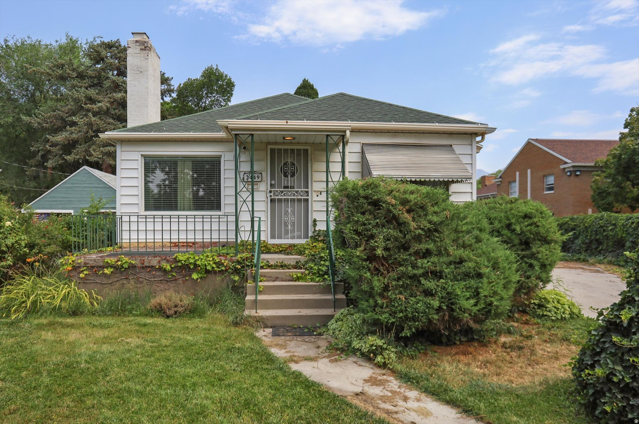 Charming fully fenced  3-bedroom, 2-bath bungalow located on a quiet dead-end street, thoughtfully renovated in 2017. Designed for entertaining, this home features a covered outdoor kitchen and BBQ area, multiple patios, and a spacious deck for gathering with family and friends. Inside, enjoy inviting living spaces perfect for both casual living and intimate dinner parties. The unfinished lower level is configured as a private primary suite with a walk-in closet. Outside, you'll find an oversized 2-car garage with a 220 EV Charging outlet, overhead storage, large workshop heated by a wood-burning stove. The expansive yard is a gardener's paradise, featuring manicured lawns, mature landscaping, a large vegetable garden, fruit trees, grapevines, raspberries, blackberries, and an abundance of perennial herbs and flowers. Automatic sprinklers, irrigation water, and included irrigation shares make maintaining this incredible property easy. A rare opportunity to enjoy space, self-sufficiency, and a simpler lifestyle while remaining conveniently close to Sugar House amenities.  Buyer to verify all information, square footage figures are provided as a courtesy estimate only.