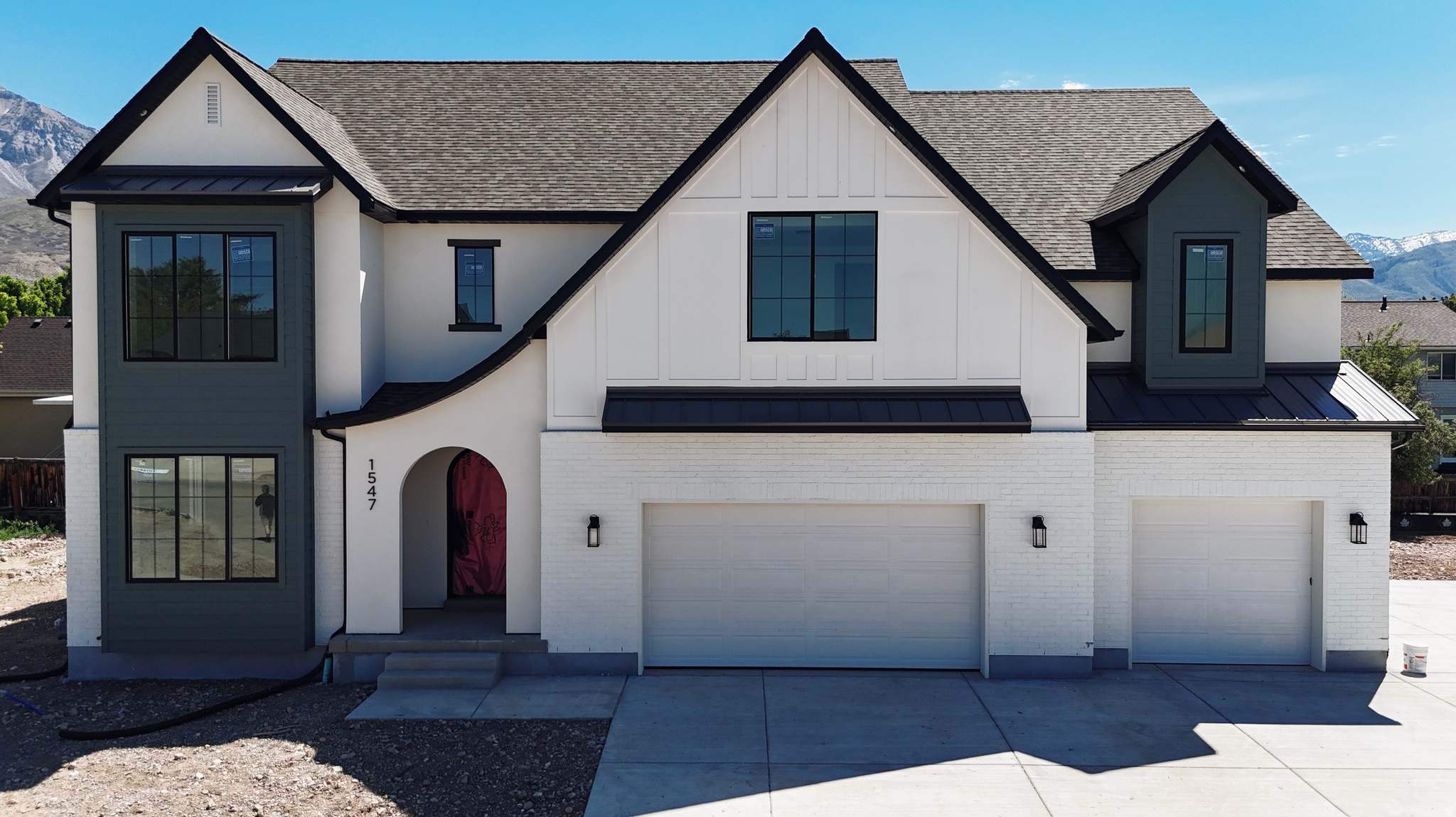 Our newest Neighborhood in Orem, Belmont West with the Avery Floorplan.  This stunning Tudor two-story home features a breathtaking two-story family room with an abundance of windows, allowing you to bask in natural light and enjoy spectacular views. The home boasts a luxurious butler's pantry with custom cabinetry, a commercial gas range, and a built-in twin fridge/freezer combo-perfect for entertaining and everyday living .Quartz counter tops, with designer touches throughout and so much more.. Basement entrance for future ADU  and it is Scheduled for completion Mid May, this home is a must see!