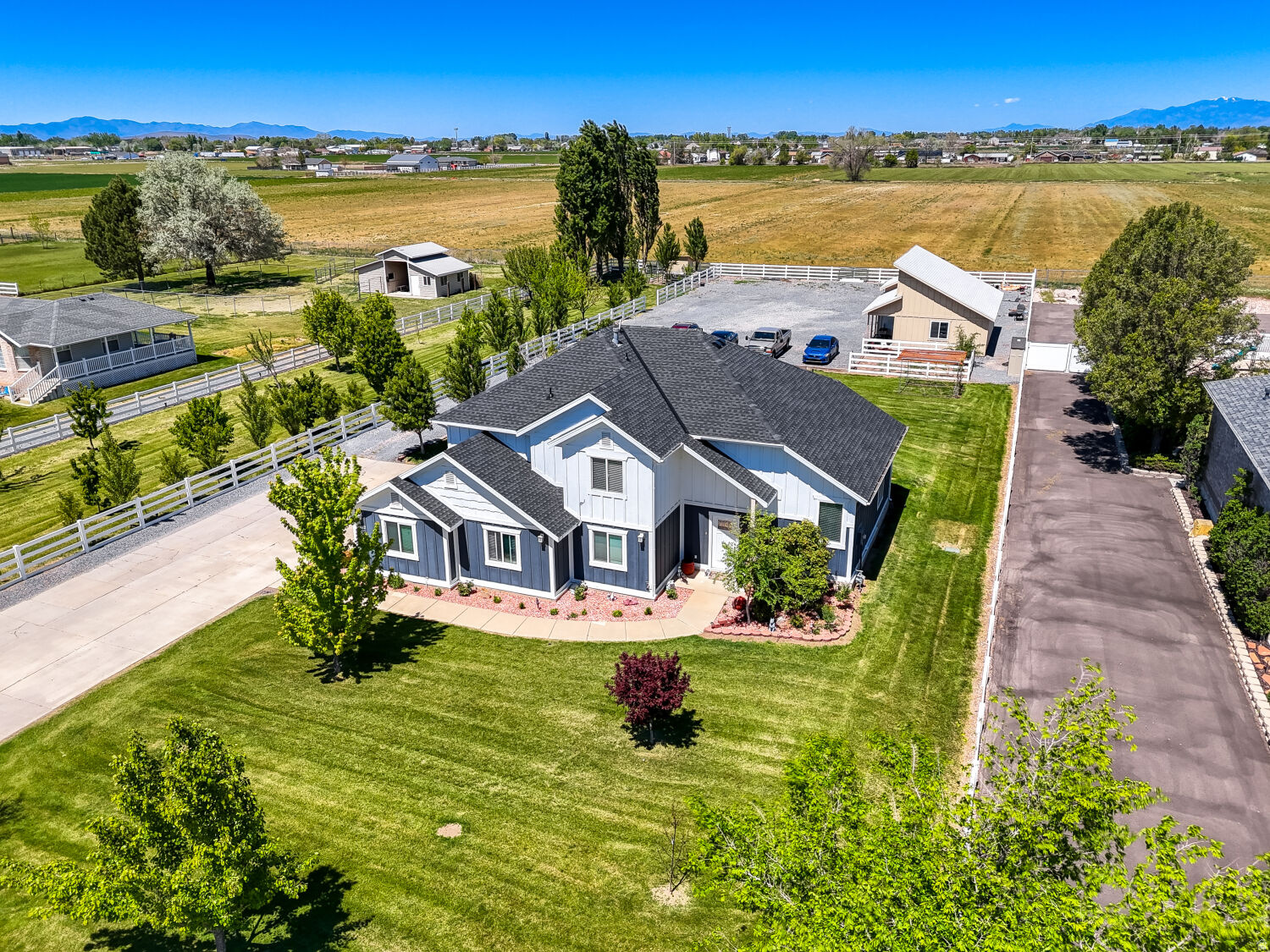 Rare horse property opportunity in desirable Hooper! Situated on 1.03 acres, this spacious 2-story home offers 3,122 sq ft with 5 bedrooms, 3 bathrooms, and the highly sought-after feature of dual master suites, providing flexible living arrangements for multi-generational living, guests, or expanded household needs.  The home has seen numerous major updates including a new roof, new siding, fresh interior paint, updated flooring, and dual HVAC systems featuring 2 furnaces and 2 condensers for enhanced comfort and efficiency throughout the home.  Outside, the property offers the space and functionality horse-property buyers are looking for, along with mature fruit trees that add beauty, shade, and seasonal harvests. Included with the property is an owned 1/2 share of irrigation water, providing added value and practical utility for maintaining the acreage, landscaping, or pasture areas.  With ample space both inside and out, this property offers endless potential for animals, recreational vehicles, gardening, outdoor entertaining, or simply enjoying the privacy and open feel of country living while still being conveniently located near schools, shopping, and commuter access.  Don't miss this rare opportunity to own updated acreage property with valuable irrigation water rights in one of Weber County's most desirable rural communities.    https://portal.diakrit.com/orderfiles/13000000/13710000/13719500/13719578/Deliveries/13719578_2-520-85_video_web.mp4  https://www.zillow.com/view-imx/735f74c8-8cc4-4c77-9c6e-dc34ba2b2bdd?setAttribution=mls&wl=true&initialViewType=pano&utm_source=dashboard