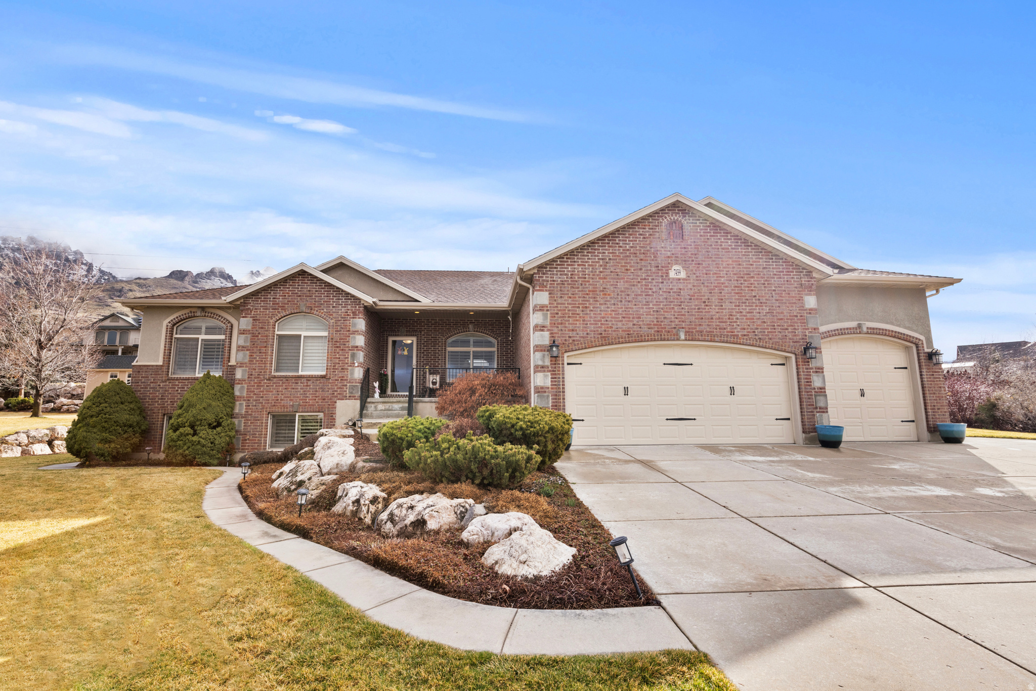 MULTIPLE ASKING PRICE ADJUSTS MADE! INCOME POTENTIAL WITH THE BRIGHT AND SPACIOUS RENTABLE ADU IN THE BASEMENT! Come and see this beautiful rambler located in Willard!  This home has it all! 4 bedrooms, 3.5 baths, 2 family rooms, 2 fireplaces, a formal living room, an upstairs and downstairs kitchen and laundry. All of this on a spacious 0.46-acre lot. The oversized four-car garage, along with the large backyard shed, provides plenty of storage space. A new roof was installed in 2020. The home is located on the East Side of Hwy 89 providing picturesque sunsets. The second kitchen and laundry in the basement are perfect for an apartment, guests or a mother-in-law suite. The thoughtfully landscaped yard includes cherry and peach trees along with raised garden boxes. Schedule your showing of this fantastic home today!