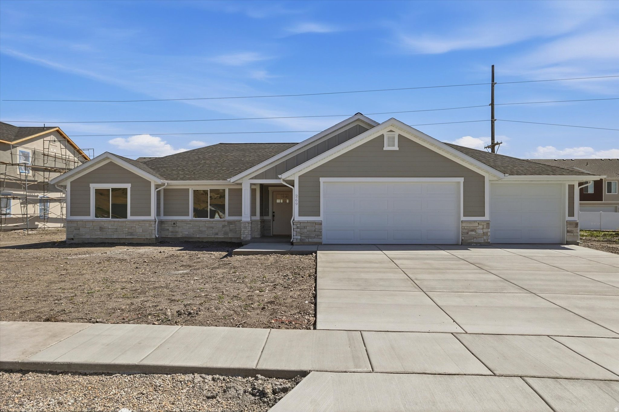 Sitting in a vibrant new neighborhood in Brigham City UT, this stunning brand-new patio home features breathtaking views and high end finishes. With 3 bedrooms and 2 bathrooms, this home offers an open-concept layout, where vaulted ceilings and abundant natural light create an inviting atmosphere ideal for entertaining. The spacious kitchen is equipped with modern appliances and plenty of cabinet space. The 3 car garage is convenient for your vehicles or extra storage. Enjoy the convenience of single-level living where the master suite is a true retreat, featuring a walk-in closet and a connected bathroom complete with two sinks, a large soaking tub, and a separate shower. Don't miss your chance to see this remarkable home in person-be sure to check out the virtual tour!