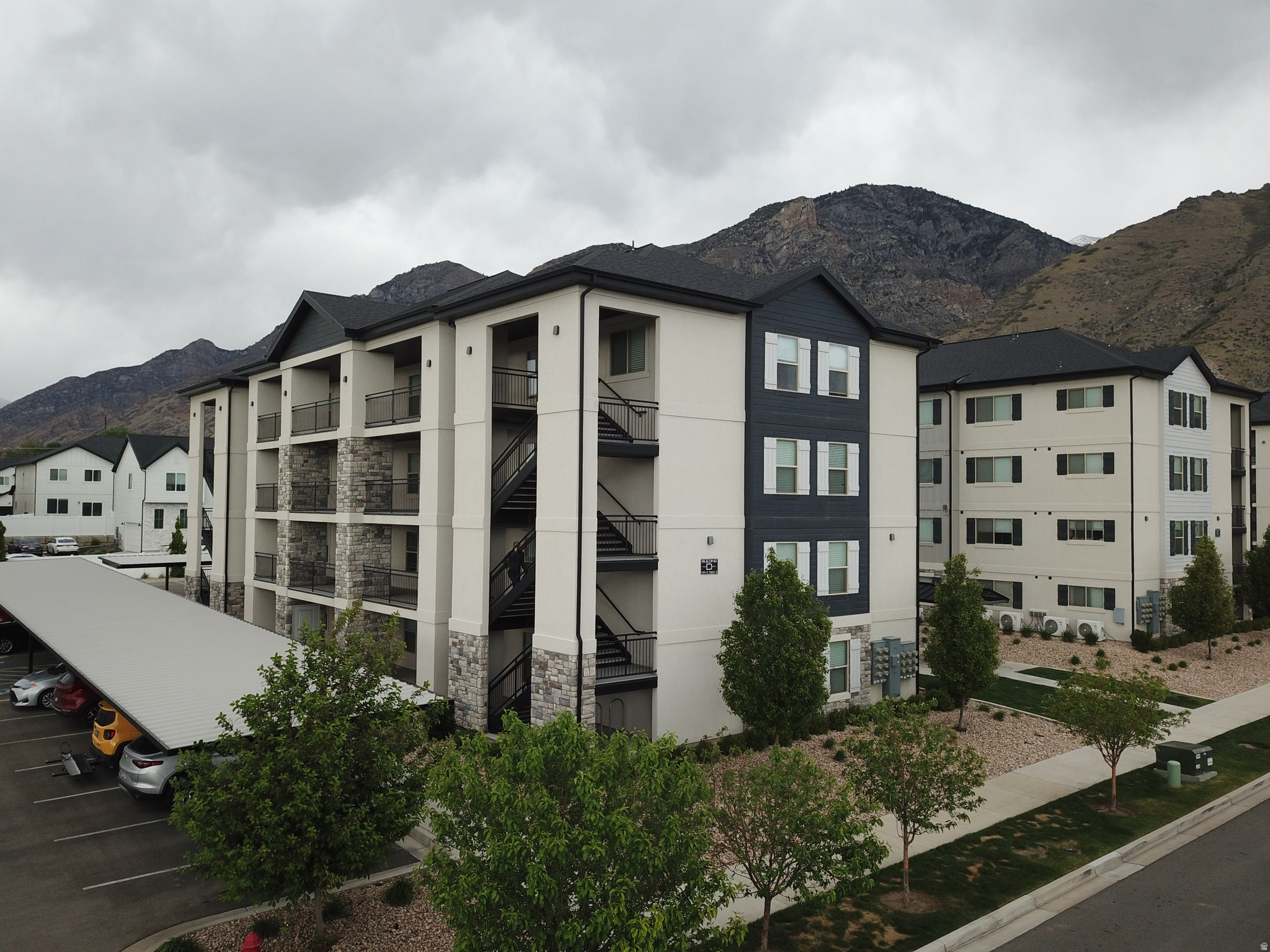 Bottom Corner Unit!  Beautiful, clean, and on the main floor corner.  This condo is perfect for your empty nester, young family, or first time homebuyer.  FHA approved and away from the street.  Best building in the development with easy access to your covered parking spot.