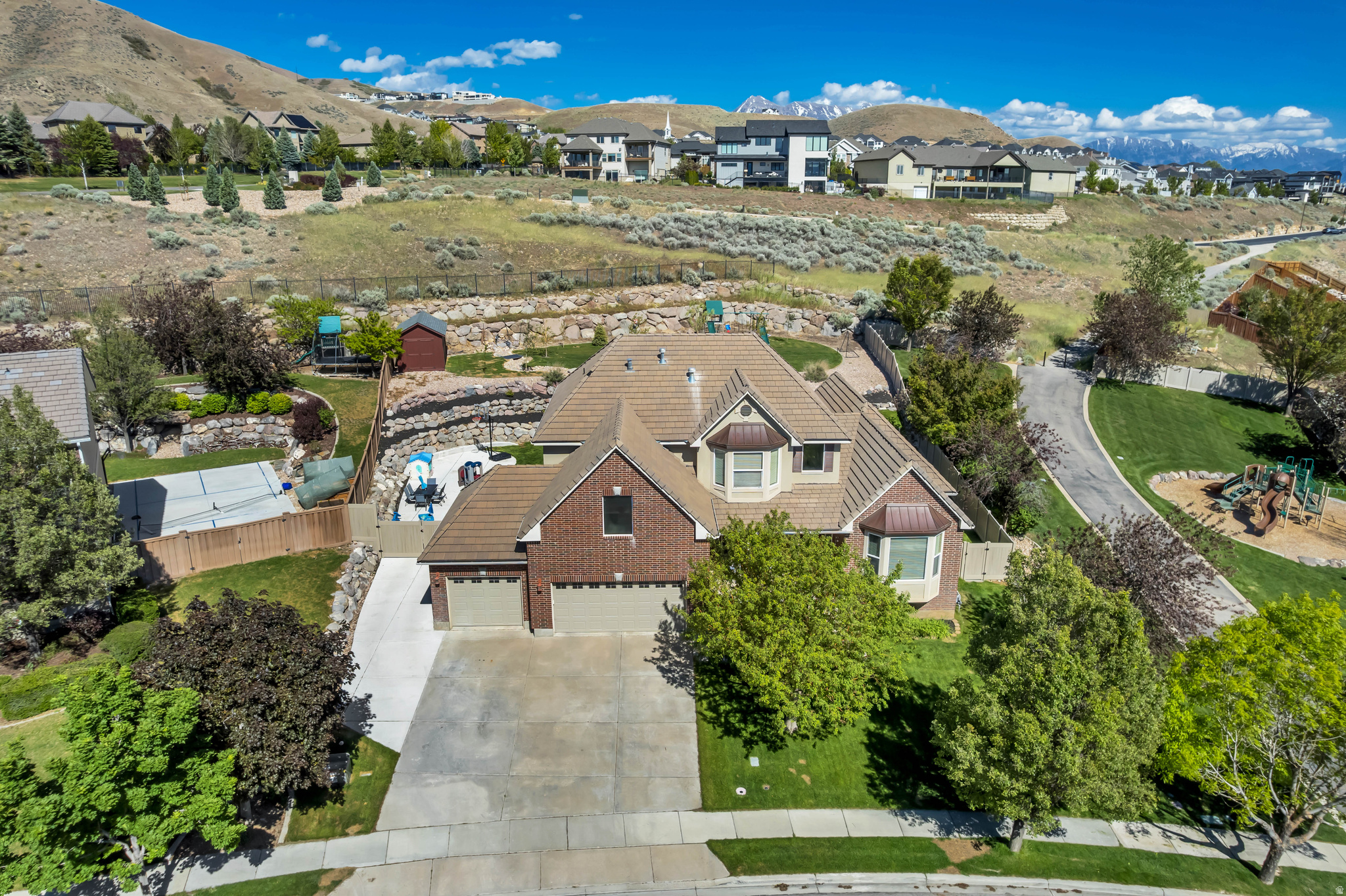 Beautiful Traverse Mountain Home with Walkout Basement & Scenic Privacy. Welcome to this desirable two-story home located in the highly sought-after Traverse Mountain community in Lehi. Offering 6 spacious bedrooms and 3.5 bathrooms, this home features a functional and inviting floor plan designed for both comfort and entertaining. Step inside to find tall ceilings and abundant natural light that create a bright and open atmosphere. The main-level primary suite provides convenience and privacy, complete with a walk-in closet and a luxurious ensuite bath featuring a separate tub and shower. Upstairs offers its own private wing, including two generously sized bedrooms, a loft area, and a full bathroom with large sink perfect for family or guests. The recently finished walkout basement adds incredible flexibility, with room to customize your dream space-whether it's a future kitchen, home gym, theater, or game room. Enjoy outdoor living in the beautiful backyard with a unique elevation, offering both privacy and space for entertaining, play, or relaxing.