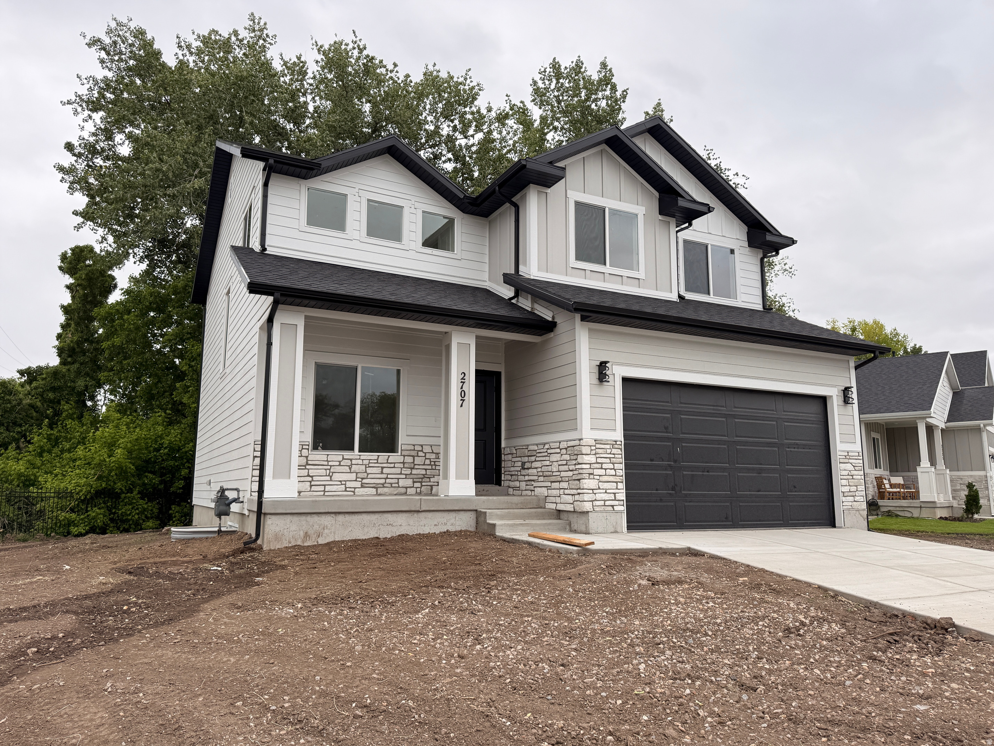 Brand-new two-story home in Magna with modern finishes and thoughtful design. Kitchen features soft-close painted cabinets, quartz countertops, waterproof LVP flooring, a large island, and walk-in pantry. Upstairs offers four spacious bedrooms and a large laundry room. Unfinished basement allows room for two bedrooms, a bathroom, and family room. Includes cultured rock exterior, and front porch. Easy access to Hwy 201 and Salt Lake City. Move-in ready.