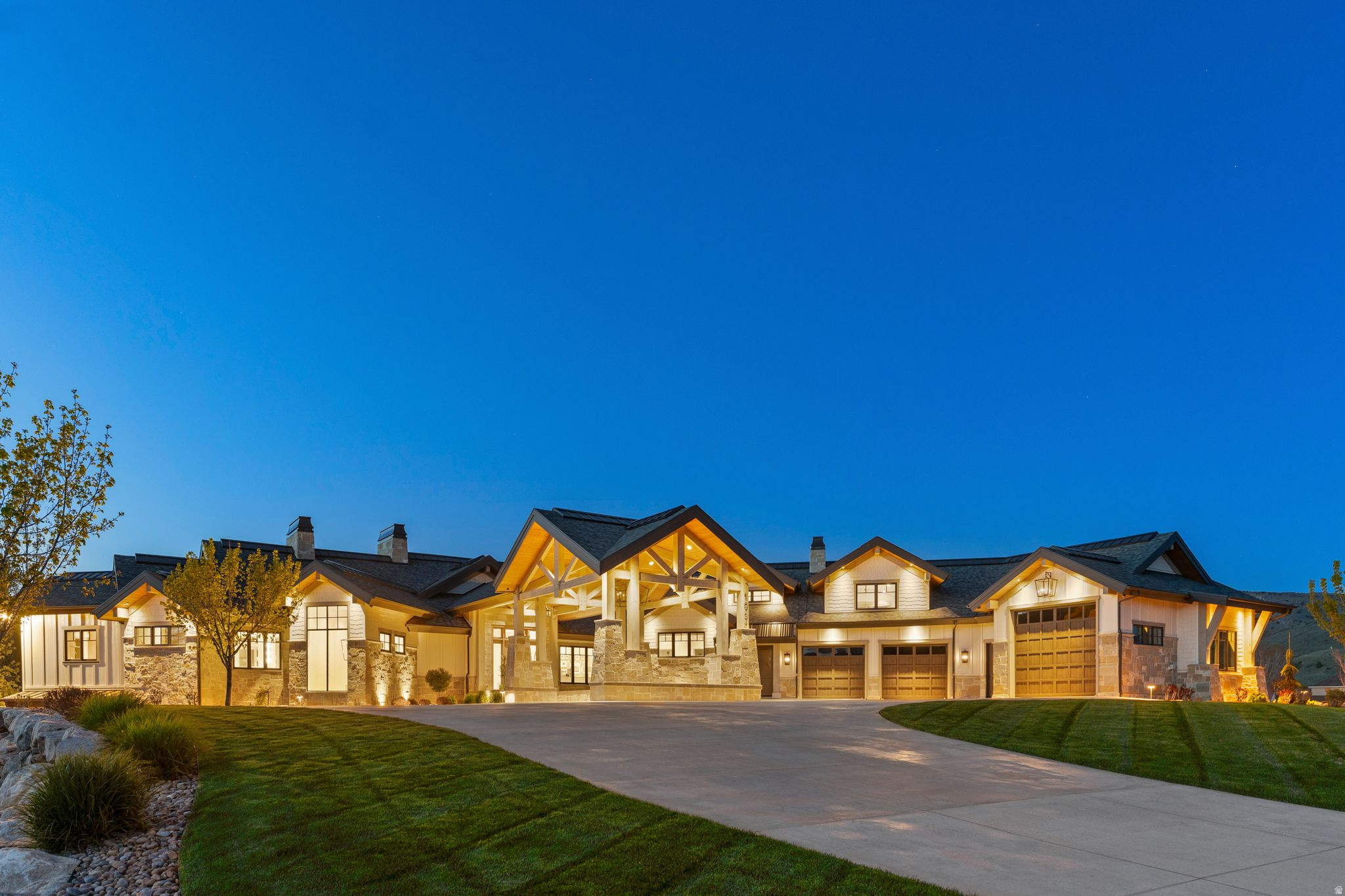 Where mountain mornings meet lakeside afternoons, this private mountain retreat represents one of the highest levels of quality and design in Ogden Valley. Set on over three private acres with a river running along the backyard, the property offers rare seclusion while remaining just minutes from Snowbasin, Powder Mountain, and Pineview Reservoir. Exceptional craftsmanship is evident throughout, including radiant heated floors, en-suite baths, and thoughtfully designed spaces that balance comfort with architectural presence. The main level features a chef's kitchen with Wolf appliances and butler's pantry, expansive gathering areas, a private primary suite, and dedicated office. Designed for hosting at every scale, the lower level includes a secondary kitchen, bar, lounge, golf simulator, and guest accommodations. Outdoor living extends to covered terraces with fireplaces, a lighted pickleball court, and open acreage. A rare opportunity to own a private mountain retreat in one of Northern Utah's most sought after communities. All property information, boundaries and documents to be verified by buyer.