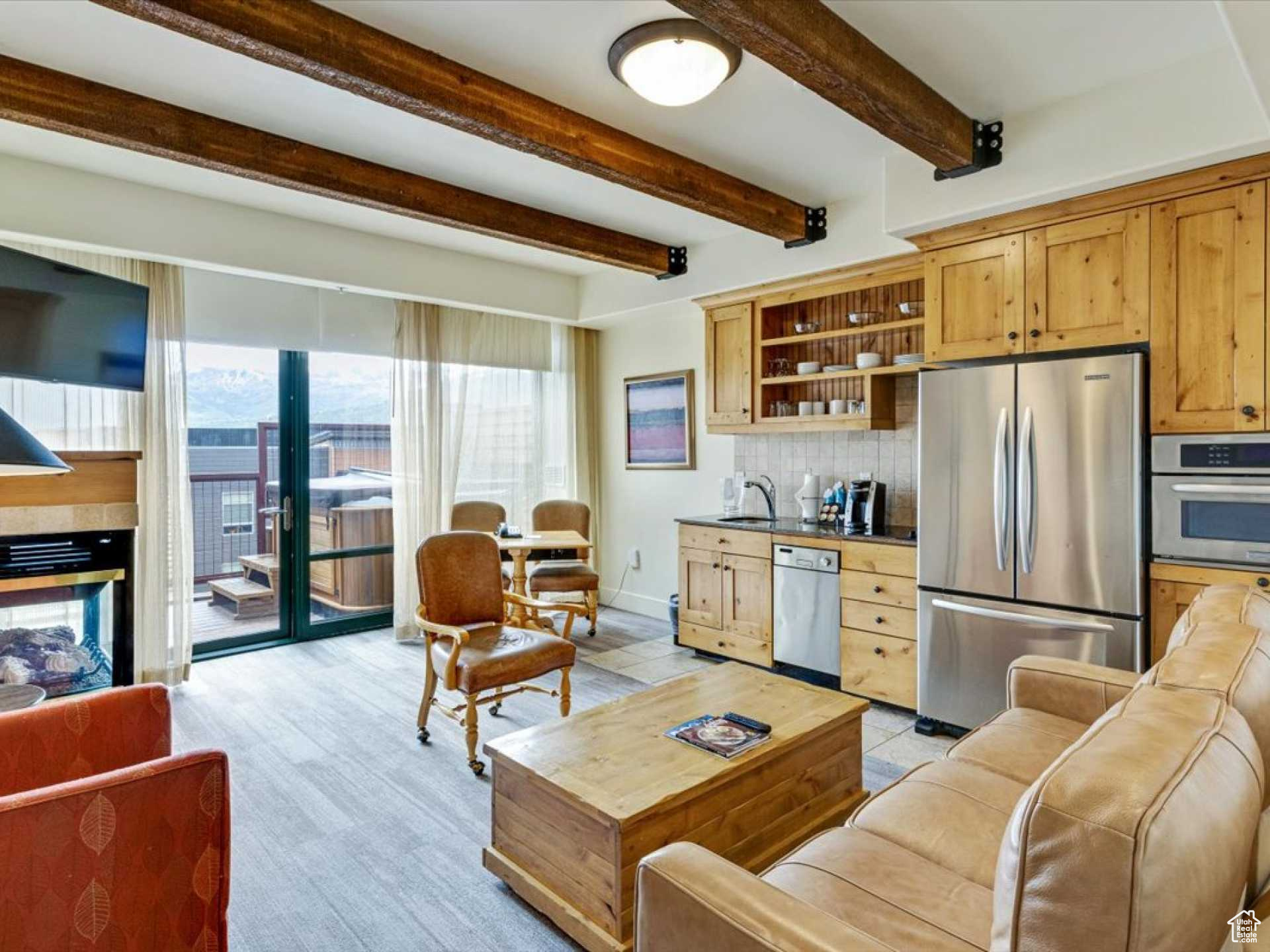 Indulge in the ultimate mountain retreat with this stunning 2-bedroom, 2-bath top-floor condominium spanning 1111 SF. Embrace the breathtaking ski area and mountain vistas from your private south-facing balcony, complete with a rejuvenating hot tub. Nestled right in the heart of the action, this prime location allows you to stroll to a plethora of amenities, including top-notch restaurants, vibrant bars, boutique shops, fitness centers, grocery stores, a movie theater, and numerous town attractions. The building itself boasts an array of luxurious features, including an indoor-outdoor pool, steam room, sauna, common area hot tub, exercise room, conference facilities, meeting rooms, and a welcoming lobby. Moreover, the town center is adjacent to a sprawling 1000-acre nature preserve, providing an oasis of tranquility amidst the adventure. Miles of biking, walking, and hiking trails invite you to explore the surrounding beauty at your leisure. Elevate your vacation experience or create cherished memories with your family in this extraordinary condo, positioned at the heart of it all. Enjoy unmatched convenience and make this dreamy retreat your very own.