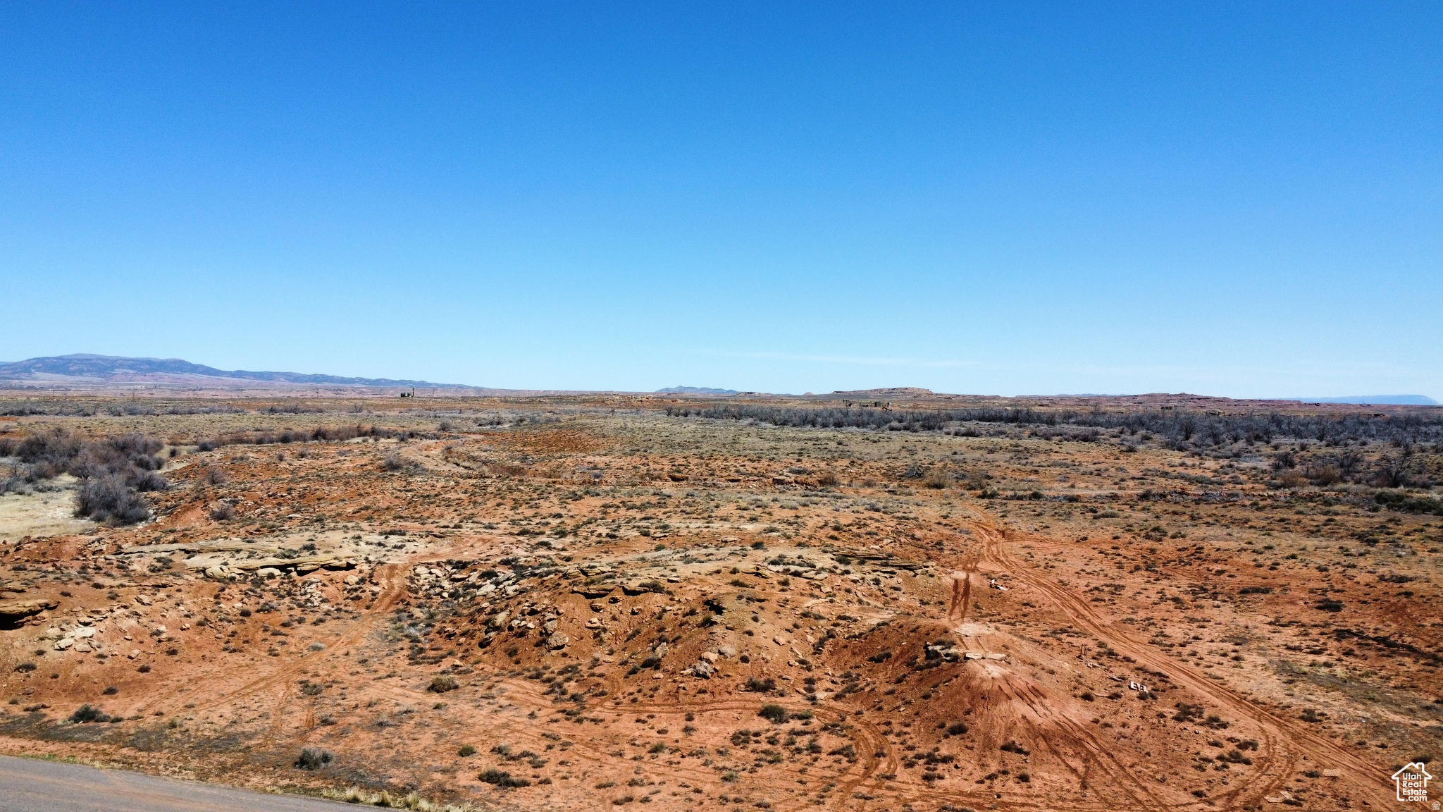 10 Acres in the Gusher area. Great potential for building a home, there are nearby homes.  Power is nearby, no water shares included. Buyer to verify all details including cost of utilities.