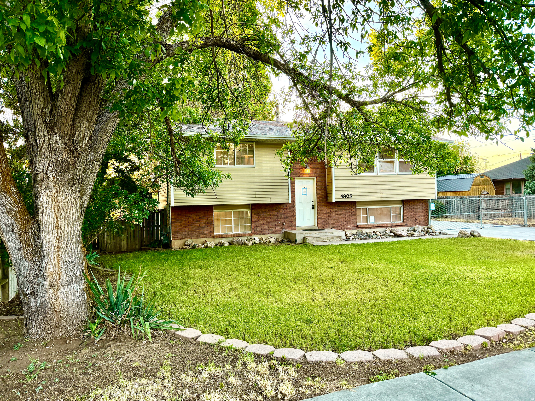 *** Multiple Offers Received - if writting an offer please write your highest & best! ***  LUCKY YOU! Rare Opportunity to buy this 2,000+ square foot home with 4 bedrooms, 2 baths, a mostly finished basement, and ALL NEW CARPET! .Sitting on .23 acres, this lot lives LARGE, with a covered, solid wood deck just off the dining and kitchen area, the sunsets glow, and trees provide the perfect amount of shade. Upgraded kitchens are always a bonus - this one features oak cabinets, including customized corner appliance cabinets, a dishwasher, refrigerator, electric range & microwave. The basement mostly finished with 2 bedroom, a very special bath with a large jetted tub & a surprisingly big shower, family room, workshop, finished laundry room, and a basement entrance. The driveway is extra wide, extending to almost the end of the lot! The back portion being a poured floor and posts for a roomy 2-car garage - as it sits you can park at least six cars - a major upgrade. The yard is fenced with a driveway gate to complete the enclosed area. It's really a very great home at an even better price! **** PLEASE NOTE the basement finished room that would usually be used as a family room was used as 4th bedroom. As if all of this isn't enough... BRAND NEW CENTRAL AC was just installed!!  The natural 4th bedroom is 95% sheet-rocked, all power and venting is run, and the past occupants used this as a second workshop instead, it's filled with shelves & a 2nd workbench!  Updated Furnace w/ new AC should create an extraordinarily energy efficient home for you.   **Legal: This home was acquired through foreclosure, as such there is no property disclosure because the owner has no knowledge of the property. Information provided is deemed reliable, but not guaranteed, buyer and buyer's agent to verify all information to their own satisfaction.  Square footage was taken from previous MLS listing.  SELLER WILL CONSIDER PAYING BUYERS' CLOSING COSTS IF INCLUDED IN THE OFFER. PLEASE CHECK WITH THE LISTING AGENT IF YOU HAVE QUESTIONS! SOLD AS-IS WHERE IS.
