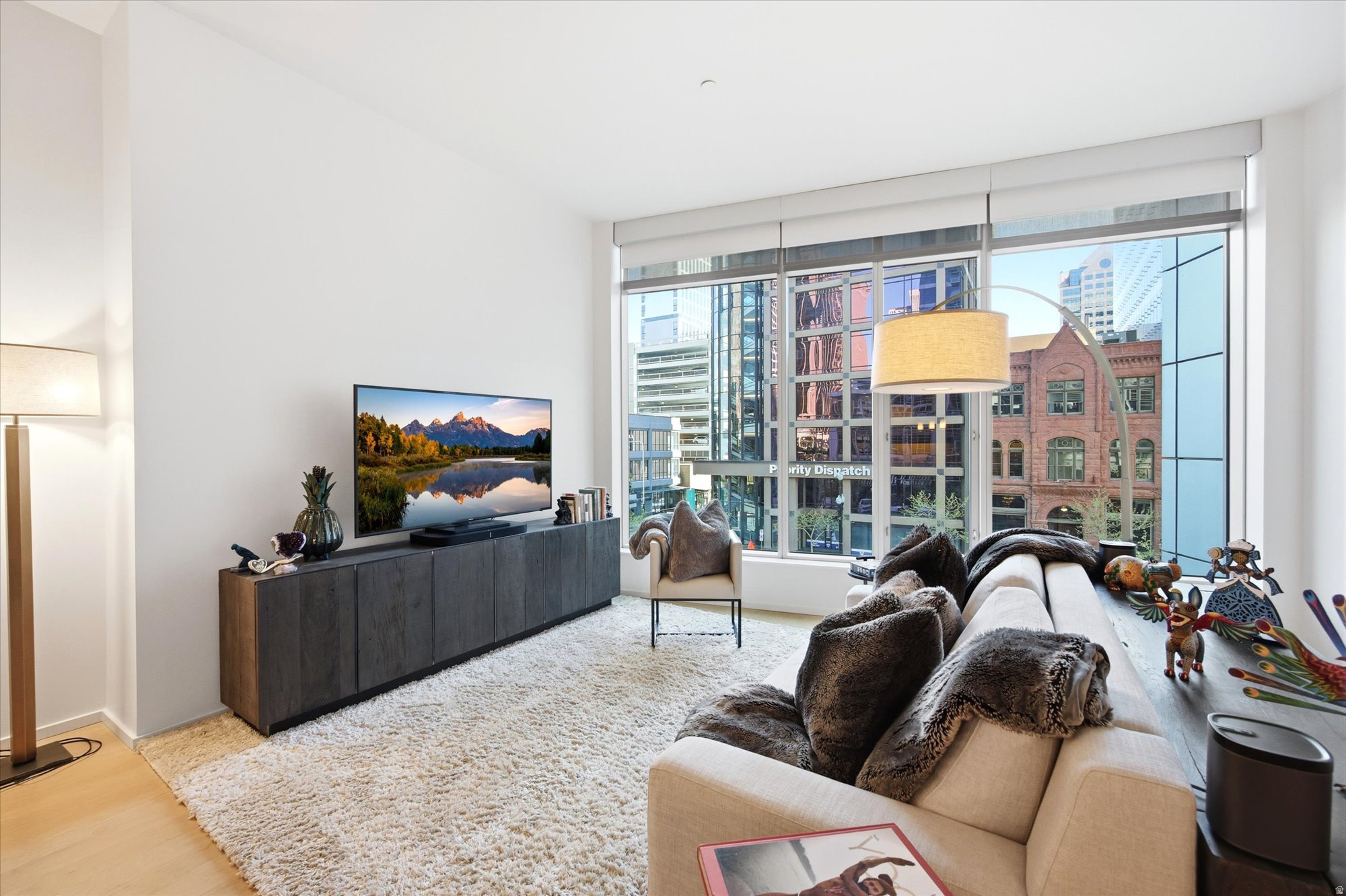 Experience elevated downtown living in one of Salt Lake City's most sought-after luxury residences, The Regent at City Creek. This beautifully upgraded condo offers the perfect blend of style, space, and urban energy, all in the heart of downtown. Soaring ceilings and expansive windows flood the home with natural light, creating an open, airy atmosphere throughout its 1,310 square feet of thoughtfully designed living space. Situated on the second floor, the residence enjoys unique views of a charming historic building across the street, while offering a front-row seat to the vibrant energy of downtown Salt Lake City. The spacious kitchen is both functional and elegant, featuring abundant cabinetry and generous counter space, perfect for everyday living and entertaining alike. What truly sets this home apart is access to an exceptional collection of resort-style amenities rarely found in downtown living. Residents enjoy a stunning pool deck with a wraparound balcony, a large hot tub, two cold plunges, luxurious locker rooms, and towel service that makes every day feel like a stay at a boutique resort. A fully equipped private fitness center is just steps away from the pool area, making it easy to prioritize wellness without ever leaving the building. The Regent also offers multiple gathering spaces available exclusively to residents at no additional cost, including two large event and entertaining rooms within the building, ideal for hosting celebrations, meetings, or private gatherings. In addition, owners enjoy access to The Commons at City Creek, featuring a grand piano, a second fitness center, stylish lounge areas, outdoor seating, BBQ grills, and beautifully designed spaces for entertaining friends and family. Additional conveniences include secure underground parking, a dedicated parking space, and a large private storage unit. The building offers controlled access and lock-and-leave convenience for those seeking both luxury and peace of mind. Step outside and find yourself in the center of everything Salt Lake City has to offer. City Creek Center's premier shopping and dining are just outside your door, Temple Square is only a block away, and the TRAX station provides direct access to Salt Lake International Airport. For those who appreciate arts and culture, few locations compare. The Eccles Theater is directly across the street, bringing Broadway productions, concerts, and world-class performances just steps from your front door. The historic Capitol Theatre, home to Ballet West and Utah Opera, is only a block away, while Abravanel Hall, home of the Utah Symphony, and several additional performing arts venues are all within easy walking distance. Whether you're enjoying an evening performance, dining downtown, or exploring the city's vibrant cultural scene, everything is right at your fingertips. Imagine finishing a workout, stepping into a cold plunge, soaking in the hot tub overlooking downtown, then walking to dinner, a Broadway show, or Temple Square without ever getting in your car. It's the kind of lifestyle most people experience on vacation, but at The Regent, it's simply home. Whether you're looking for a sophisticated primary residence, a downtown retreat, or a low-maintenance luxury lifestyle, this home delivers the very best of city living.