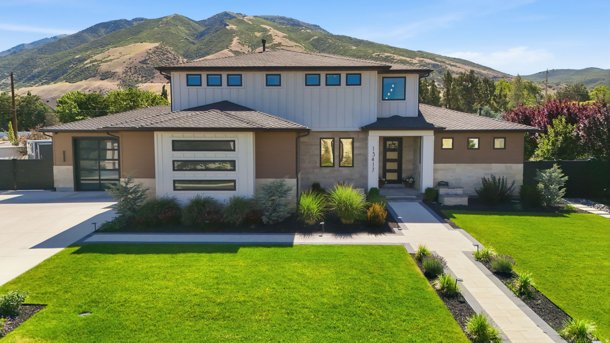 Experience elevated living in this exceptional 2023 PARADE HOME built by Aspen Lane Homes, perfectly situated on a premium .54-acre lot in one of Draper's most sought-after streets. Designed with luxury, recreation, and comfort in mind, this stunning 6-bedroom, 6-bathroom residence offers an unmatched lifestyle with HIGH-END FINISHES and RESORT-STYLE amenities throughout.  The thoughtfully designed floor plan showcases a luxurious main-level primary suite featuring a cozy fireplace, custom closet built-ins, and a spa-inspired primary bathroom designed for ultimate relaxation. Entertain effortlessly in the GOURMET KITCHEN, complete with premium Wolf appliances and exceptional craftsmanship throughout the home.  Designed for year-round enjoyment, the property features a huge PRIVATE GYM, professional PICKLEBALL COURT, SAUNA, HOT TUB and COLD PLUNGE-bringing a true wellness retreat home. Golf enthusiasts will love the custom GOLF SIMULATOR room, complete with a wet bar, beverage fridge, multiple TV's and is adjacent to the back patio for perfect indoor/outdoor entertaining. Step outside to enjoy the covered patio with breathtaking MOUNTAIN VIEWS and no backyard neighbors, offering exceptional privacy. The canal trail running directly behind the home provides easy access to outdoor recreation and scenic walks. The WEST-FACING orientation delivers one of Draper's most desirable features-cool summer evenings with premium backyard shade.  Additional highlights include an OVERSIZED GARAGE with hanging storage, EV-HOOK-UPS (2), abundant parking, and dedicated space for an RV or BOAT.  This rare luxury property seamlessly blends sophistication, recreation, and everyday comfort in an unbeatable Draper location. Square footage figures are provided as a courtesy estimate only and were obtained from an independent appraisal .  Buyer is advised to obtain an independent measurement.  All information is deemed accurate and reliable.  Buyer and buyer's agent to verify all.