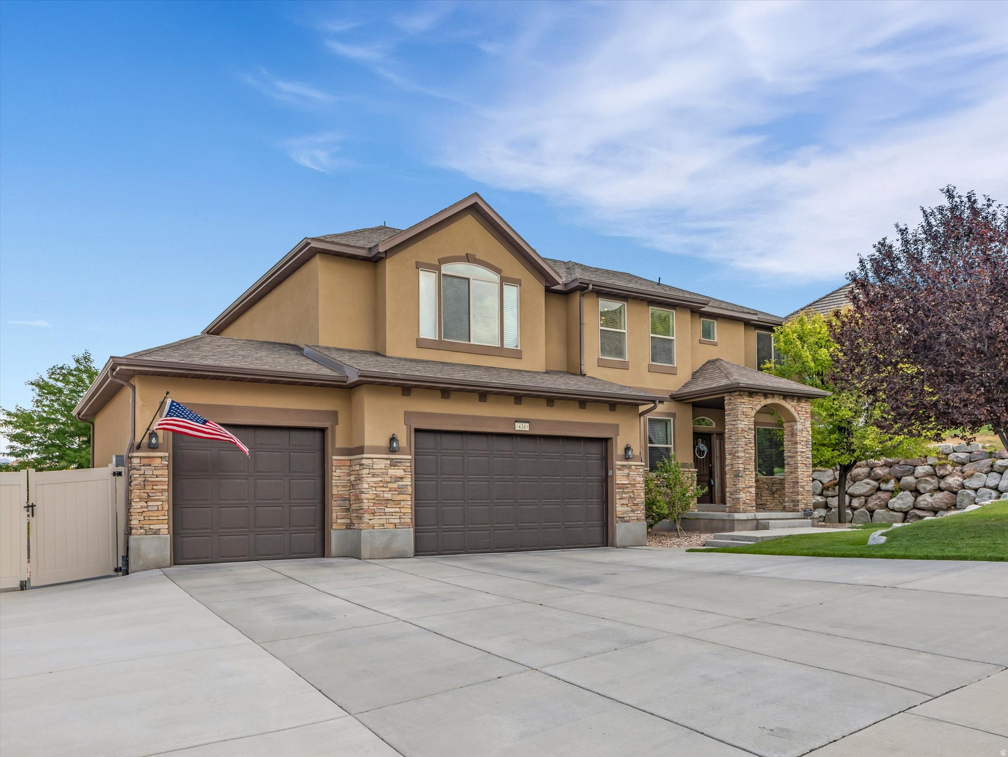 Welcome to this beautifully maintained two-story home, where thoughtful updates, quality craftsmanship, and exceptional outdoor living come together. Built in 2009 and meticulously cared for, this move-in-ready home offers a spacious and functional floor plan designed for both everyday living and entertaining. The main level features elegant formal living and dining rooms, a private den, and an inviting two-story family room highlighted by soaring ceilings, abundant natural light, and a cozy gas fireplace. The kitchen is well-appointed with black stainless steel appliances, granite countertops, ample cabinetry, and generous workspace for the home chef. Upstairs, you'll appreciate the vaulted ceilings, spacious bedrooms with walk-in closets, and beautifully remodeled bathrooms that add a fresh, modern touch. The finished basement provides additional living space ideal for a recreation room, home theater, fitness area, or guest accommodations. Situated on an impressive 0.33-acre lot, the backyard is truly a private retreat. The east-facing orientation creates cool, comfortable evenings to enjoy the professionally landscaped, park-like setting complete with a tranquil water feature, expansive Trex deck, Bullfrog hot tub with automatic hard cover, and a custom firepit area-perfect for relaxing or entertaining family and friends. Additional highlights include a three-car garage, extra-large RV parking pad, radon mitigation system, newer water heater and water softener, and dual HVAC systems for year-round comfort. Located in a quiet, highly sought-after neighborhood just steps from open mountain recreation, this exceptional home also offers convenient access to shopping, restaurants, parks, excellent schools, and freeway connections. A rare opportunity to own a meticulously maintained home in one of the area's most desirable locations.