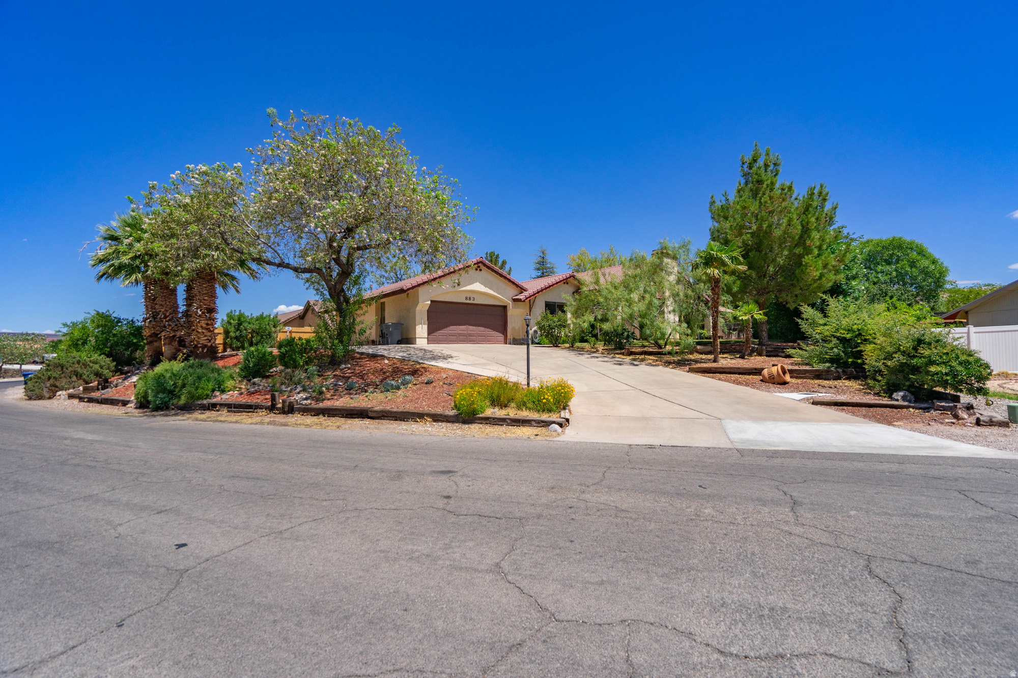 pacious Bloomington Hills home located just a few blocks from Bloomington Hills Park! This older home is ready for updating but offers a fantastic floor plan, generous room sizes, and wonderful potential. The living room features a vaulted ceiling with beams and opens to a formal dining room, creating a great space for entertaining. A covered patio sits off the dining room. The kitchen, with added solar tubes, is adjacent to a cozy family room with sliding glass doors leading a distinctive L-shaped swimming pool. The large primary suite, with it's vaulted ceiling, also has direct access to the pool and patio area. The atrium off of the entry is also visible from the primary bedroom & 2nd bedrooms. The main house includes three bedrooms, all with their own en-suite bathrooms. three bathrooms. An oversized garage provides for parking, storage, and workspace. The home also includes a small unfinished concrete basement/storage room. Just off the garage is a fourth bedroom with its own full bathroom. This flexible space could be guest quarters, a private office, hobby room, rental space, or converted into a small casita. With four bedrooms, four bathrooms, a private pool, multiple living areas, basement storage, and a versatile layout, this Bloomington Hills property is ready for a new owner to bring their vision and make it their own.