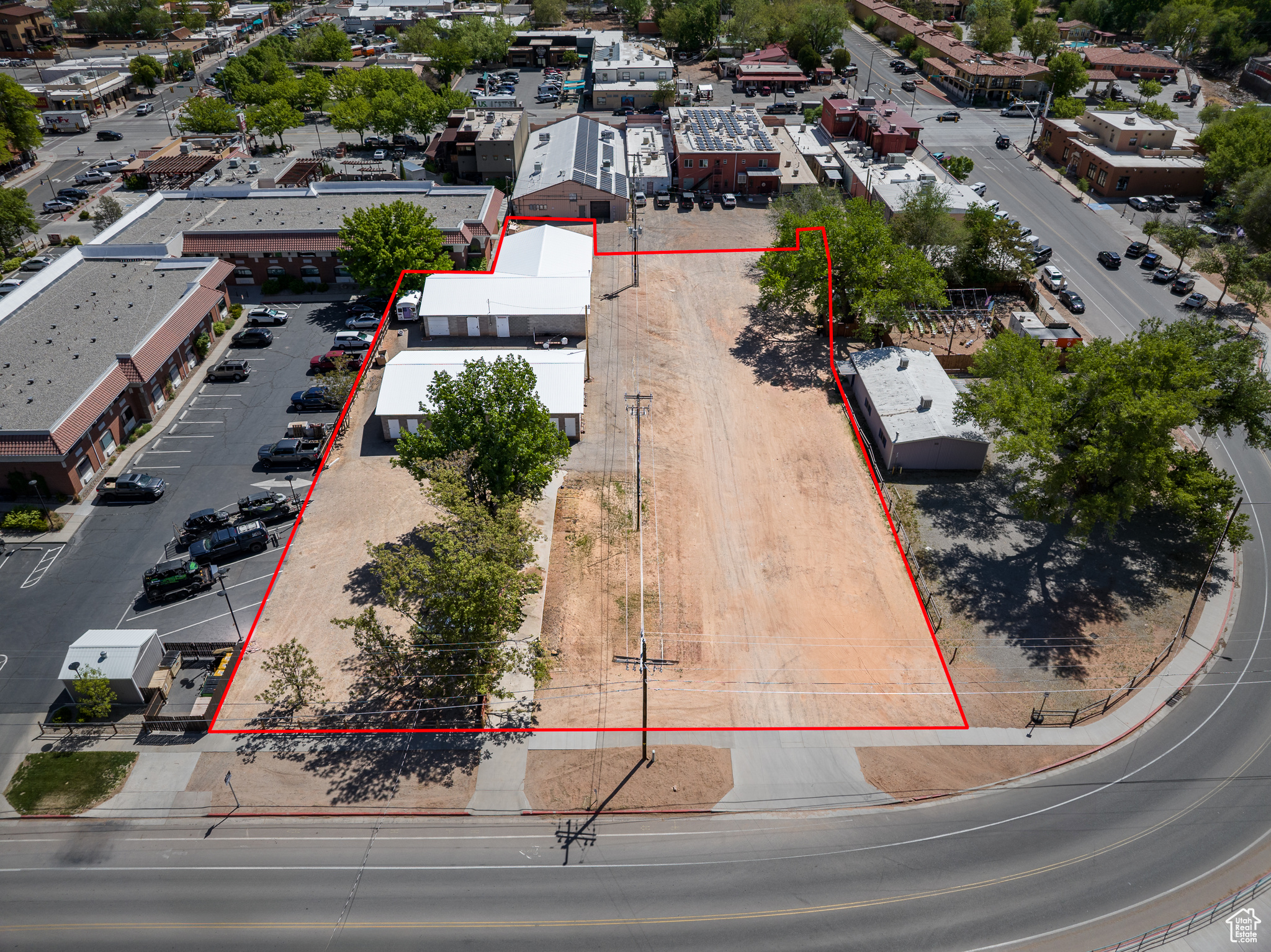 LOCATION, LOCATION, LOCATION! These three parcels combined total 1.02 acres and are close to it all! Retail, restaurants, and multiple hotels  nearby and adjacent. With Moab City's Commercial 3 zoning, these lots allow for a multitude of commercial and mixed uses.  Use the storage units currently in place maintaining steady income, or you can plan your next commercial venture. Dreaming of building a cafe with apartments above?  Planning to build an office building or a mix-use development with retail and restaurant space? Here is your site to do it all with high visibility in the heart of downtown Moab!