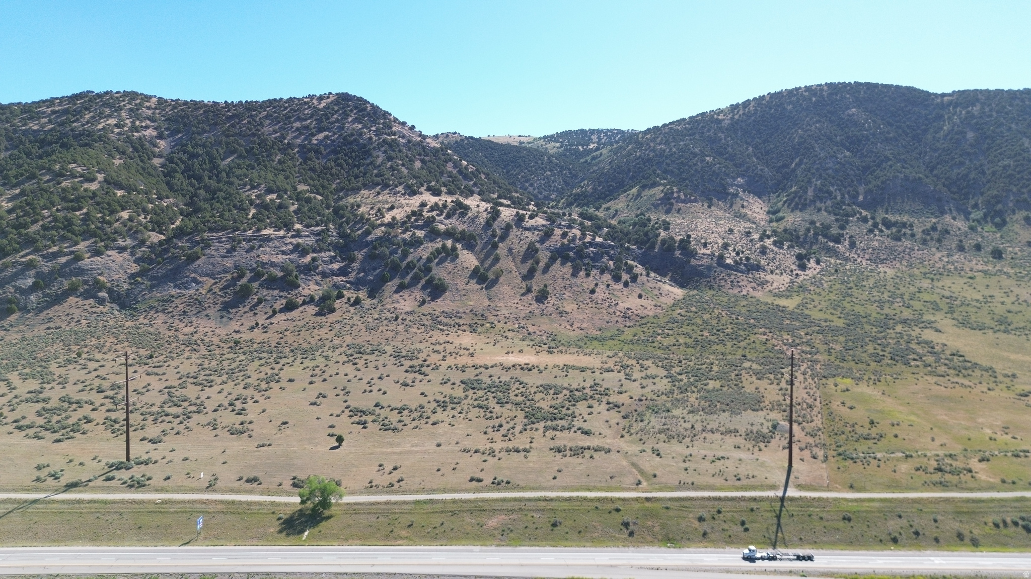 87 Acres of Native Pasture running parallel and adjacent to I-15 on the east side and directly across from Malad City.  Full access via maintained gravel frontage road with BLM Land bordering on the east side of property. Excellent opportunity for Agricultural, Commercial or even Residential use. Useable power access is approximately 1/2 mile away.  Acreage figures are provided as a courtesy estimate only and were obtained from Oneida County.  Buyer is advised to obtain an independent measurement.