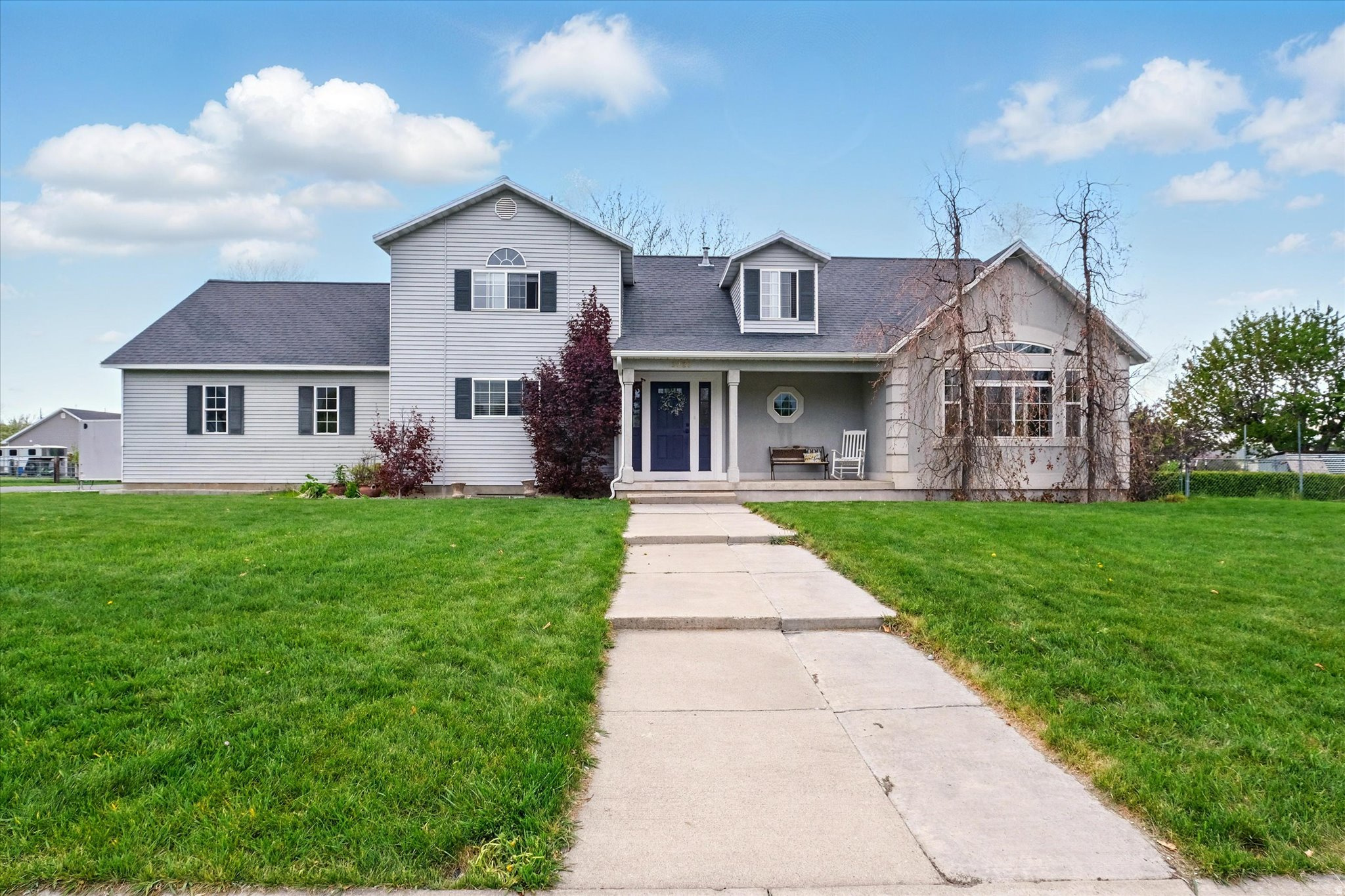This beautiful home sits on a large, flat lot with mature trees and massive garden. Fruit trees include apple, pear, and cherry as well as full raspberry patch. Enjoy beautiful mountain views from the kitchen window! Main level master featuring large shower, washer and dryer. Square footage estimates obtained from most recent appraisal. buyer advised to obtain independent measurement.