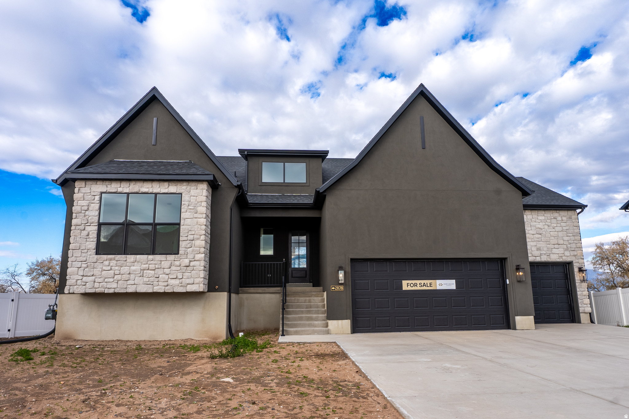 Seller is offering a preferred lender incentive! Call for details! Welcome to The Arches by Henry Walker Homes, a beautifully designed rambler in the heart of West Haven's best kept secret Cobble Creek Subdivision. This home offers effortless main-floor living, featuring 12-ft ceilings in the great room, a unique open staircase, and a bright, open layout. Enjoy quartz countertops, laminate flooring, a spacious kitchen, large pantry, and plenty of storage space. With 4 bedrooms, 3.5 baths, a partially finished daylight basement with a walkout, and a spacious 3-car garage, there's room for everything and everyone. Enjoy the best of West Haven-great schools, shopping, dining, and easy access to outdoor adventures. Experience luxury and convenience in The Arches-schedule your tour today! (Buyer to verify all information and square footage.)
