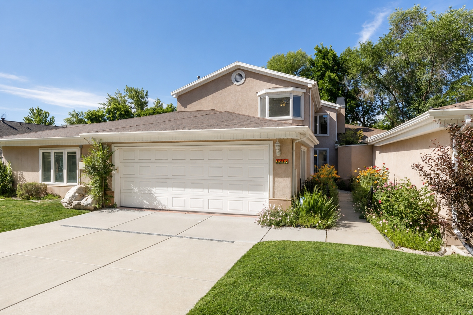 Welcome to this beautifully maintained home in the gated community of Gardens at Oak Creek in South Ogden. Backing to Birch Creek, this property offers a peaceful, private setting with a shady backyard perfect for relaxing and enjoying the outdoors. Inside, you'll find 5 bedrooms, 3 bathrooms, an open and inviting floor plan, oversized doors, and abundant natural light throughout. The primary suite features French doors, while the enclosed patio has been transformed into a versatile sunroom with a gas line for year-round enjoyment. Additional highlights include an ionized water softener, Fresh paint throughout,  updated driveway and front walkway, and a prime location just minutes from shopping, dining, parks, and trails. This move-in-ready home combines comfort, convenience, and a beautiful creekside setting. Schedule your private tour today!