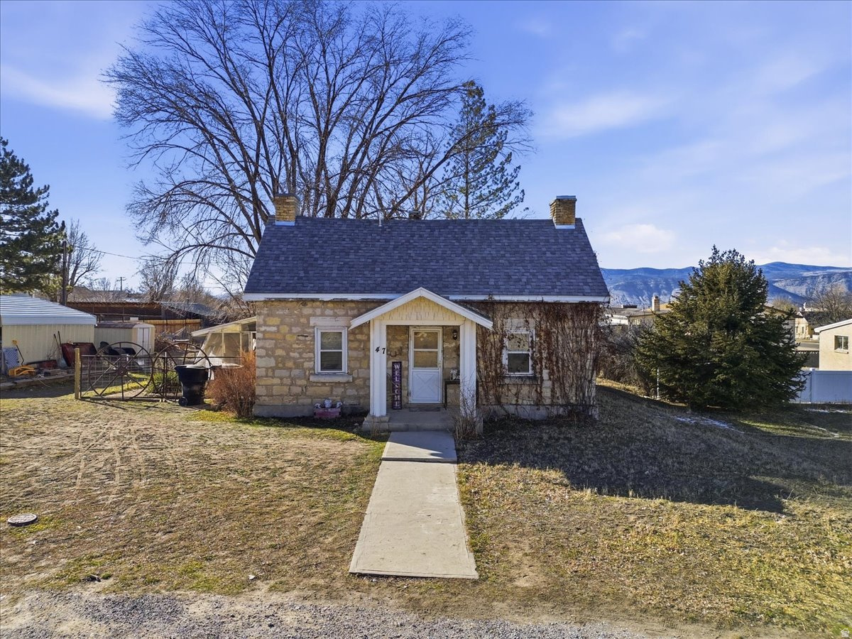 Step back in time with this charming pioneer home built in 1885, featuring beautiful white stone construction that reflects timeless craftsmanship. Thoughtful updates include new windows throughout, complete with a lifetime transferable warranty for added peace of mind. The home offers a semi-formal dining room, two bedrooms on the main level, and an additional bedroom on the upper floor, providing flexible living space. Outside, enjoy automatic sprinklers with pressurized irrigation, a convenient carport, and a storage shed in the backyard. Take in stunning views of the surrounding mountains and the iconic Manti Temple, all while being within walking distance to shopping, dining, and everyday amenities. This unique property blends historic character with modern convenience in a truly special setting.  Square footage figures are provided as a courtesy estimate only and were obtained from Sanpete county recorders office .  Buyer is advised to obtain an independent measurement.