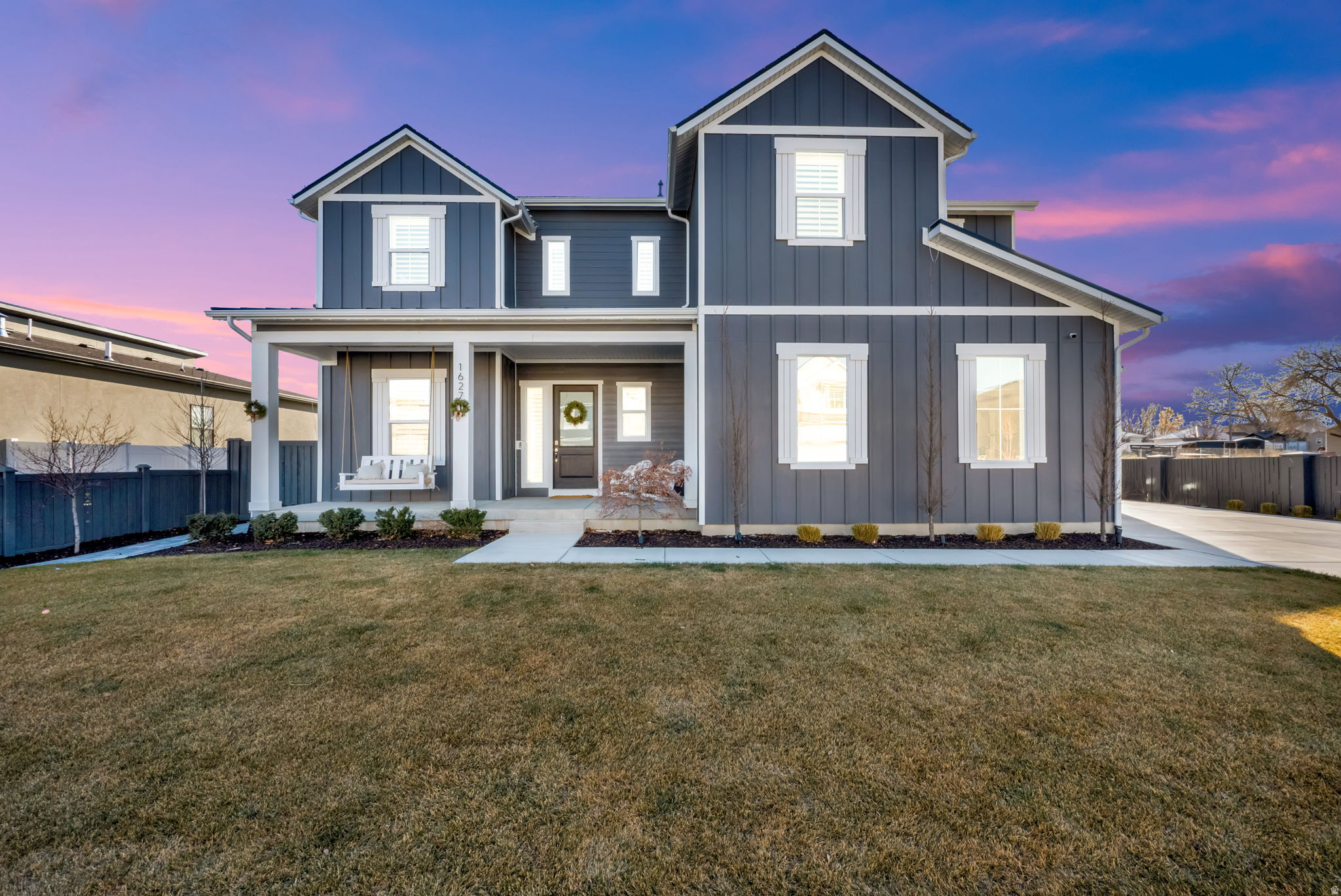 This Exceptional Farmhouse Home showcases Impeccable Curb Appeal with Timeless Style, Design and Fine Details. The Entry Welcomes you with an Inviting Front Porch, Soaring Ceilings and accessibility to Spacious Living and Dining areas. The bright Island Kitchen features Sleek Cabinetry, Quartz Countertops, 2 Pantries and a Butler's Pantry. Spacious main floor Family Room includes Built-Ins with a charming Fireplace. Stately Executive Office. Relaxing Primary Suite with Separate Tub and large Walk-In Closet. Upstairs features 3 additional Oversized Bedrooms and Laundry Room. Lower level is designed for Entertainment, boasting a Family Room, Game Area, Guest Bedrooms and Bathrooms. Home is equipped w/Tankless Water Heaters. Painted and Finished 3-Car-Garage is complete w/Epoxy Floors, Built-In Work Bench and Custom Storage Cabinets. Enjoy the Beautiful Private, Fenced Yard and Inviting Covered Patio surrounded by Lush Landscaping. Located on a Quiet Road. Close to Big Cottonwood Canyons and Premier World Class Resorts. Conveniently close to shopping and Dining.