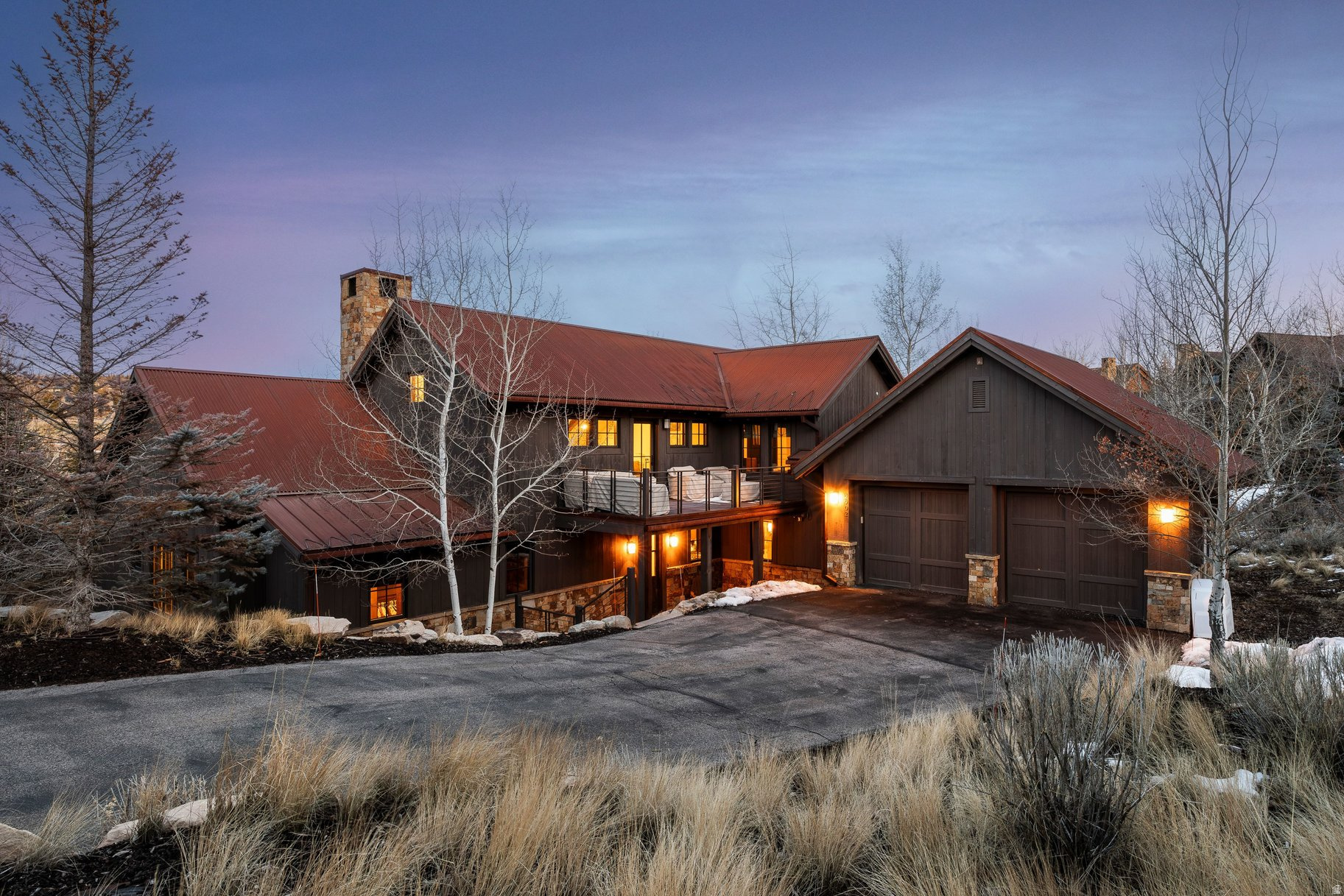 Welcome to 2902 Quick Draw, a Park City residence tucked into a quiet Promontory cul-de-sac. This Trapper Cabin blends comfort and versatility, featuring two main-level suites with direct deck access-ideal for multigenerational living or private retreats. Warm wood and stone finishes, expansive windows, and well-designed shared spaces create a timeless mountain aesthetic, seamlessly connecting indoor and outdoor living. Just a short walk from The Shed, pools, fitness amenities, and the Signature Pete Dye Championship Course, this home offers mountain lifestyle with unmatched convenience.