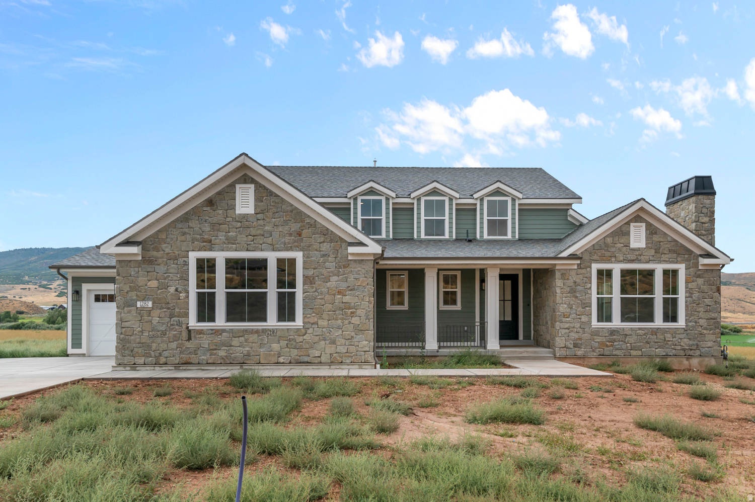 Come see this gorgeous Hampton Traditional home that blends timeless elegance with modern comfort! Featured you will find a chef's dream of a kitchen with custom cabinets with under-cabinet lighting, quartz countertops, full height tile backsplash and stainless steel Caf gas appliances. The atrium door in the kitchen nook enhances natural light and the 9-foot basement foundation walls and 3-car courtyard garage is designed for spacious living. An expanded covered deck offers an ideal outdoor retreat, with a gas line to the BBQ. Inside, enjoy the warmth of gas log fireplaces in both the family and living rooms. Thoughtful details like can lighting, Christmas light package, textured walls, 2 tone paint and entrada base & casing elevate the home's refined aesthetic and tile surrounds in the bathrooms and brushed nickel hardware add a level of elegance. All located in a great country feel community! Check it out today!