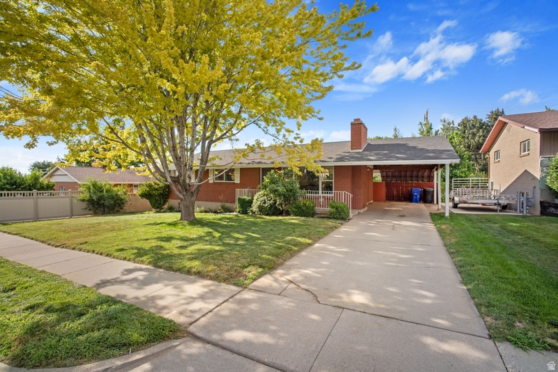 Beautiful Mid-Century home blending timeless character with thoughtful modern updates! This bright, open floor plan creates an inviting atmosphere themoment you step inside. Gorgeous hardwood floors lead into a spacious living room featuring a cozy wood-burning fireplace, while the light-filled kitchen offers stainless steel appliances, a gas range, and stunning teak butcher block countertops. The oversized primary bedroom serves as a peaceful retreat with dual closets and abundant natural light. The fully finished basement provides exceptional flexibility with two additional rooms that are ideal for bedrooms, guest space, home offices, or hobby rooms, plus a large family room with a second fireplace, a spacious laundry room, and ample storage. Outside, enjoy a generously sized backyard with irrigation water, complete with mature apple tree, a beautiful grapevine, and a fire pit-perfect for entertaining, relaxing, or enjoying quiet evenings under the stars. New Furnace/A/C 2025 | Water Heater 2023. |Within minutes to nearby Bountiful Elementary and Millcreek Junior High.  If you're looking for a home with Mid-Century charm, modern updates, flexible living space, and an incredible backyard in a great locationthis one is a must-see.  Square footage figures are provided as a courtesy estimate only and were obtained from County Records .  Buyer is advised to obtain an independent measurement.