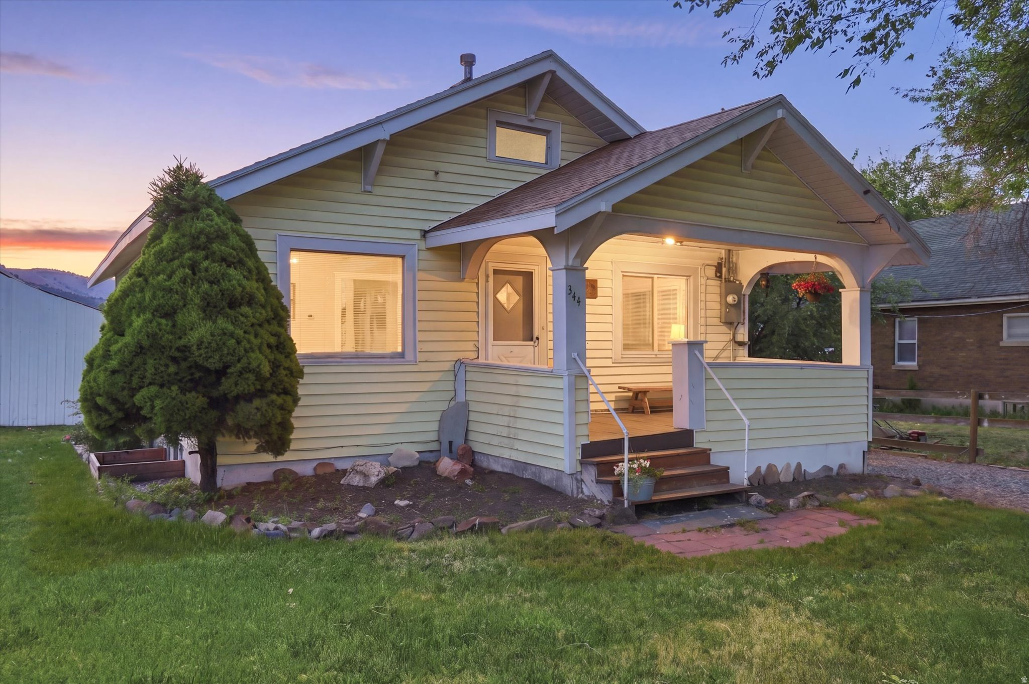 Charming bungalow with an awesome front porch - perfect for first-time buyers or investors! This 3 bed, 1 bath home has been nicely updated with new LVP flooring in the kitchen, a refreshed bathroom, newer roof and furnace to name a few!  Sitting on 0.27 acres with mature trees, sprinkler system, and spacious outbuildings for storage and your toys. Turnkey and full of character! Call to schedule your showing today!