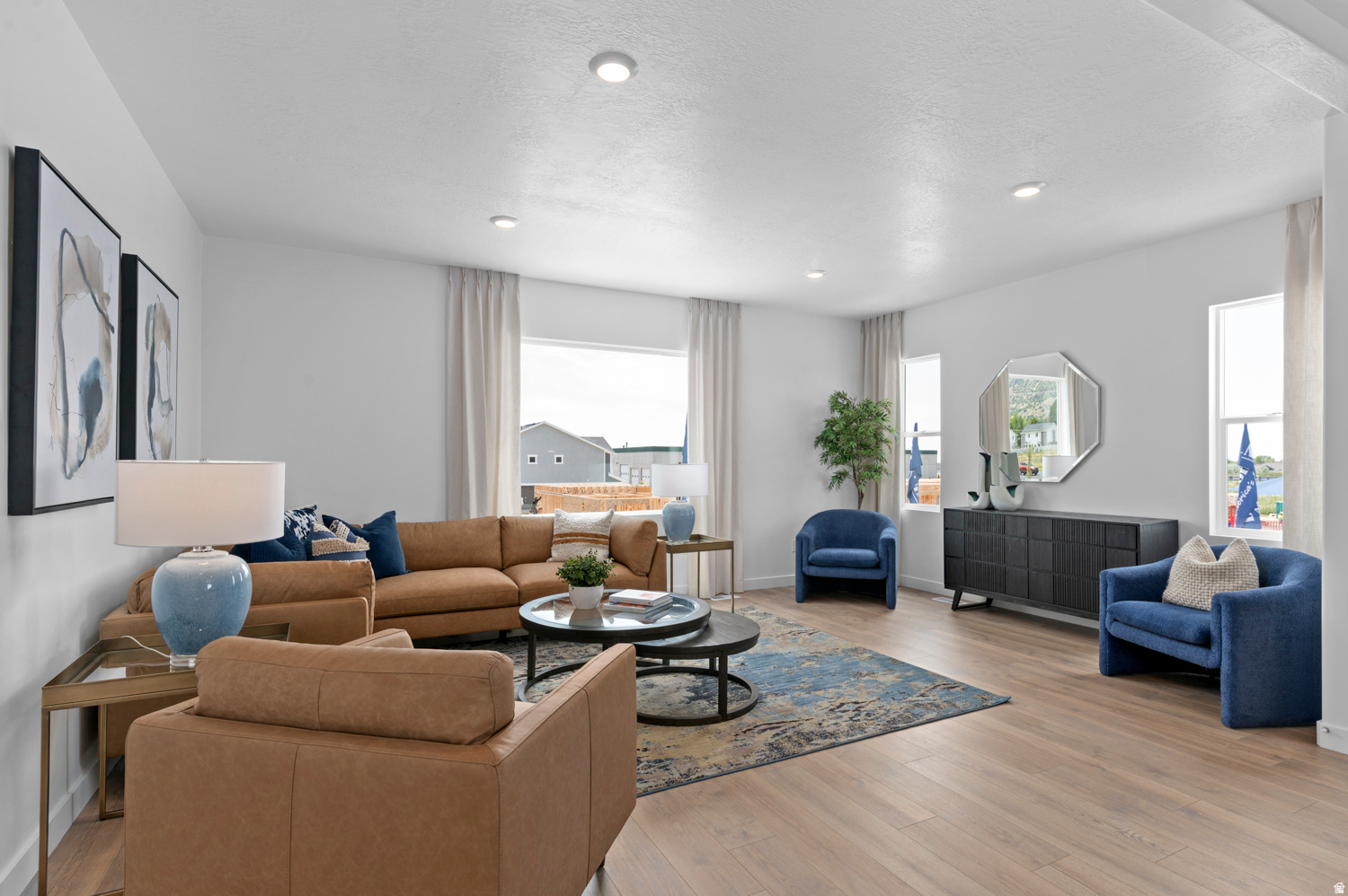 This spacious Mid- Unit Oliver floor plan is the same as the model home: 4 bedrooms, 3 full bathrooms, and a 2-car garage. Did I mention the HUGE open concept kitchen/living /dining with 9ft ceilings? Enjoy spectacular mountain views, nearby parks, & quick access to a variety of restaurants, shopping, and the freeway  all within a 5-minute drive. Your ideal home, perfectly situated for a vibrant lifestyle! Ask me about our generous Home Warranty, Active Radon Mitigation System, and Smart Home Package which are all included. *No representation or warranties are made regarding school districts and assignments; conduct your own investigation regarding current/future school boundaries. Photos are of model home of the same floor plan. Selections may vary. Buyers to verify colors, materials, and options. Square footage figures are provided as a courtesy estimate only and were obtained from building plans. ***Sales Center Hours: Open Monday, Tuesday, Thursday, Friday, and Saturday from 11:00 a.m. - 6:00 p.m. Wednesday from 1:00 p.m. - 6:00 p.m. Closed Sundays. Call for an appointment!