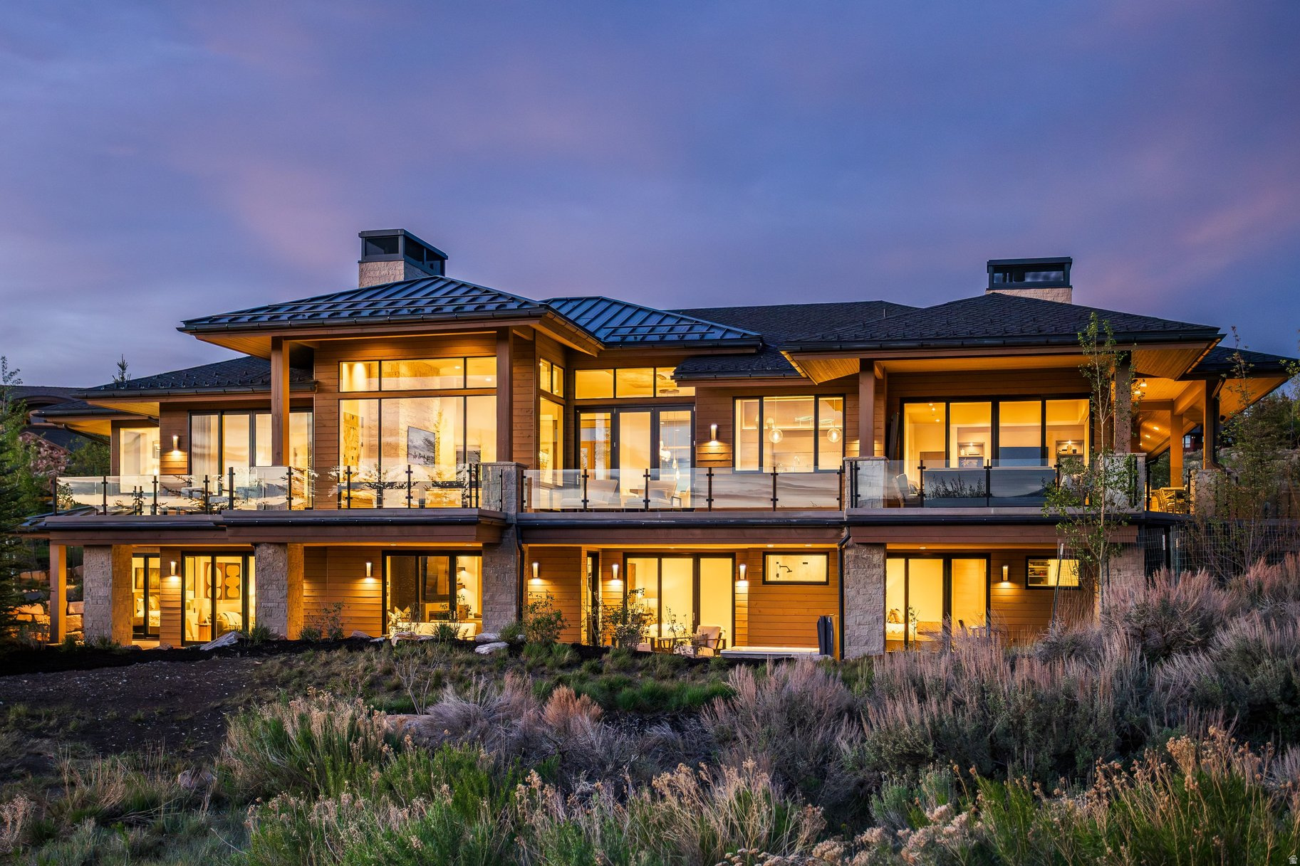 Welcome to 2647 Silver Berry Court, a contemporary mountain retreat completed in 2024 in Promontory Club, one of Park City's premier gated golf communities. Designed by Mark Walker of Otto Walker Architects and built by Knight Construction, this exceptional residence blends clean modern architecture with warm organic finishes and seamless indoor-outdoor living. Expansive gathering spaces open to heated patio decks and outdoor dining areas, creating the perfect setting for year-round entertaining. The thoughtful floor plan balances privacy and functionality with an upper-level primary suite and office featuring expansive views, while the lower level includes four guest bedrooms and a dedicated fitness room. Radiant heat extends throughout the home, including the driveway, garage and outdoor living spaces, along with thoughtful additions such as a heated dog run and oversized dog wash. Inside, designer finishes and layered textures create a timeless, elevated feel, complemented by Hammerton, Kelly Wearstler, Arteriors and Palecek fixtures, Phillip Jeffries wallcoverings, Lutron lighting and shades, Crestron AV, and central vacuum. Offering a refined yet relaxed lifestyle in the heart of Promontory, this home captures the very best of modern mountain living. Ideally located just minutes from Park City and Deer Valley, approximately 20 minutes to Heber Valley Airport and 35 minutes to Salt Lake International Airport, the residence offers exceptional convenience with easy access to world-class skiing, dining, golf and year-round recreation.