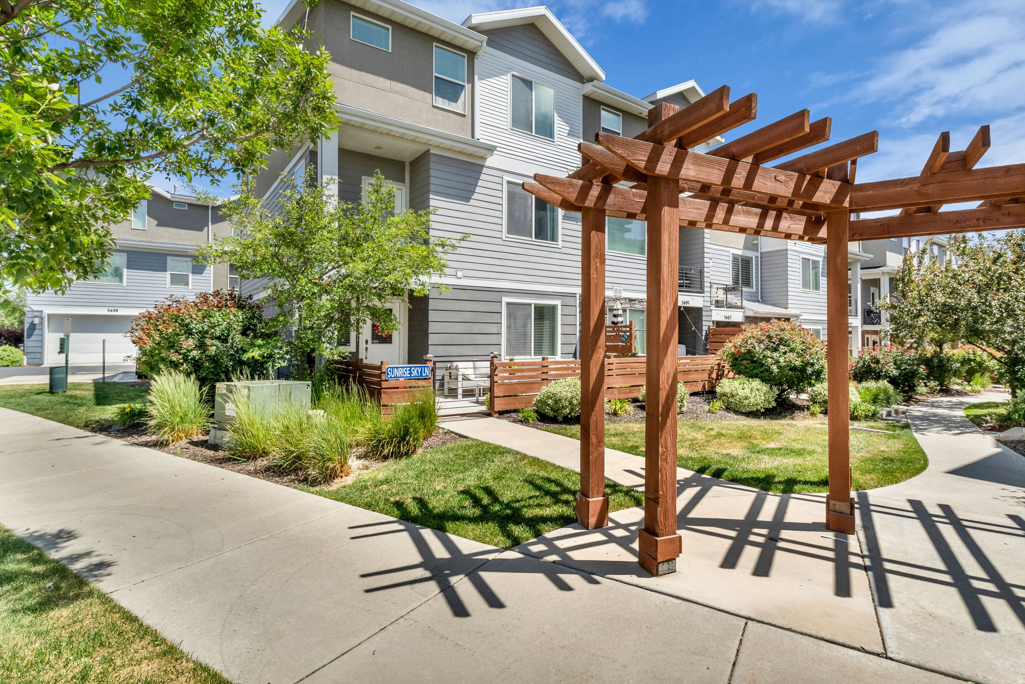 Sprawling 4 Bedroom Townhome with amazing Curb appeal. Meticulously cared for and Loads of Upgrades. 1st Level has Garage Access with Shelving that is included, 1st Bedroom and Bathroom.  2nd Level is a perfect Open Concept layout with Large Family Room, NEW Electric Fireplace,  Custom Built ins, and plenty of natural light.  Fantasic Kitchen with 12 Foot Central Island, Newer Quartz Countertops, NEW Stainless Steel Appliances, Dining Nook and Access to Deck overlooking front yard. 3rd Level has a Tranquil Primary Owners Bedroom attached En Suite Bathroom and Walk in Closet. 2 Additional Bedrooms and Hall Bathroom. Top Level Laundry room.  Flooring is 4 yrs old, Whole Home Water Filtration System, Water Softener, and NEW Water Heater.  Easy access to Main Roads, Shopping, Dining and Entertainment options all nearby.   Square footage figures are provided as a courtesy estimate only.  Buyer is advised to obtain an independent measurement.
