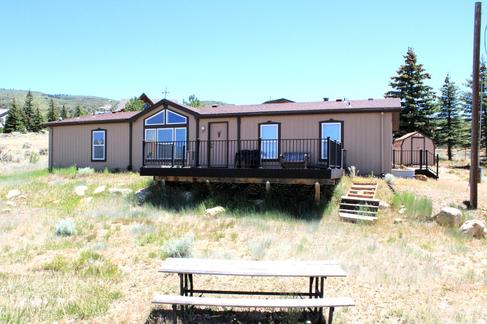 Beautifully maintained home located in Skyline Mountain Resort with access to all the community amenities. This open and bright floor plan features spacious living areas, a grand primary bathroom, and stunning valley views. Enjoy outdoor living on the large deck, complete with a fire pit area perfect for entertaining and relaxing. The property also offers RV parking, propane service, easy year-round access, and a setting that showcases the beauty of the surrounding mountains and valley. A wonderful opportunity to enjoy resort-style living in a scenic location. Furnishings are included.