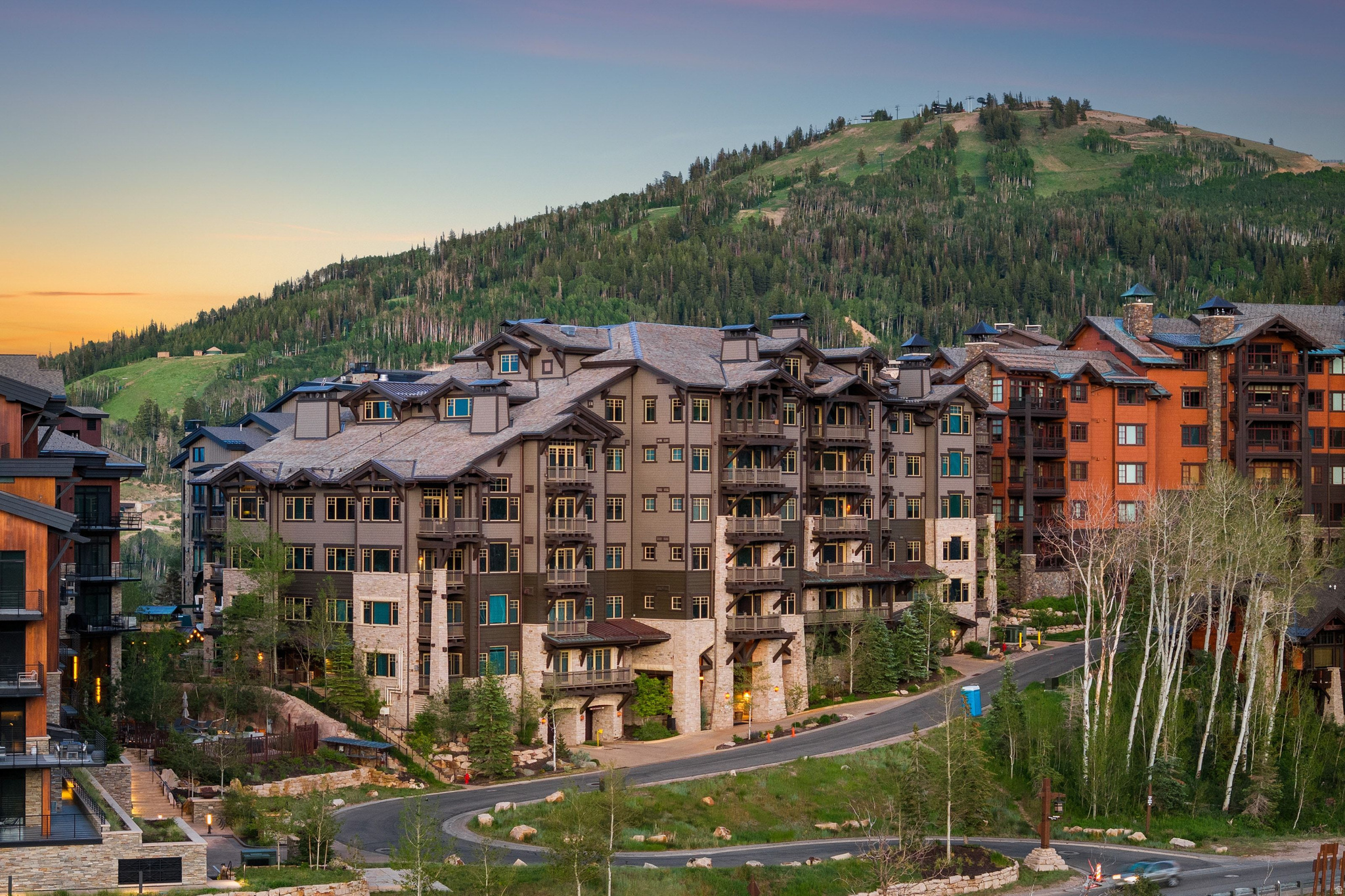 Top of the building. Top of the mountain. Top of Empire Pass. This rare top-floor, end-unit penthouse at Silver Strike Lodge represents the most coveted configuration in one of Deer Valley's most exclusive addresses-where opportunities of this caliber have become increasingly difficult to find.  Vaulted ceilings with hand-crafted beams crown a residence that lives larger than its footprint, capturing unobstructed views of Empire Canyon, Lady Morgan, and the Wasatch from every window. Taken to the studs and reimagined by Alder & Tweed in 2014/15, then curated again in 2020/21, this was no surface remodel. A wall was removed at entry to maximize the panorama. The great room fireplace was recessed 16 inches and refinished in its original stone. The primary suite ceiling was raised and coffered. The primary bath was rebuilt as a spa sanctuary anchored by a statement stone soaking tub and designer steam shower.  The details are bespoke throughout: underlit onyx countertops on the island and dry bar, distressed European wood flooring imported from Belgium, leather wall tiles in the mudroom, custom millwork in every room, and a bunk room finished with a hand-painted American flag ceiling. The chef's kitchen carries new high-end appliances, copper sink, wine cabinet, and statement onyx surfaces.  In 13-plus years of ownership the residence has never been rented and has averaged only two weeks of personal use per year. It shows accordingly-turnkey, fully furnished, and barely lived in.  The Silver Strike Express Chairlift sits steps from the lodge's private ski room, with on-site amenities including a ski butler, aprs lounge, fitness center, hot tub, firepit, shuttle service, and assigned parking. A FULL TALISKER CLUB MEMBERSHIP is available for separate purchase (buyer must apply and be accepted), unlocking The Tower Club at Empire Pass, Tuhaye golf above the Jordanelle, Courchevel Bistro and the private Main Street lounge, and The Outpost backcountry retreat.  This is the residence Empire Pass buyers wait for. They rarely wait long.