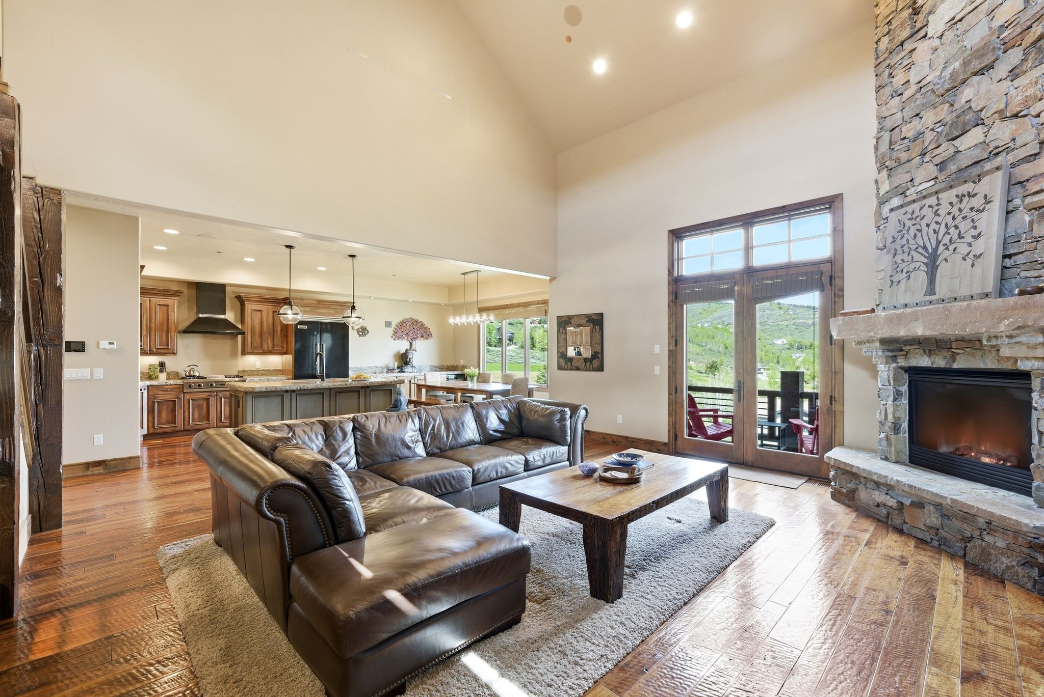 Perfectly positioned in the mountains of Jeremy Ranch and just steps from the clubhouse, this  townhome captures majestic views of the golf course and the mountain peaks of East Canyon from all three levels. Blending refined mountain living with timeless sophistication, the residence offers an exceptional setting surrounded by natural beauty. Thoughtfully designed for both everyday comfort and effortless entertaining, the open-concept floor plan is filled with natural light and enhanced by vaulted ceilings in the living area and a dramatic floor-to-ceiling stone fireplace that anchors the great room. A walkout deck just off the great room seamlessly invites the outdoors in, creating a light-filled atmosphere that perfectly frames the surrounding mountain and golf course views. The beautifully appointed kitchen features premium Viking appliances, a copper farmhouse sink, double ovens, and granite counter tops. A guest 1/2 bath and laundry room are also on the  main floor. The upper level features two spacious bedroom suites, each designed with large walk-in closets and private ensuite baths, while capturing beautiful mountain views in every direction. The walkout lower level offers a spacious family room anchored by a stunning stone fireplace, creating a warm and inviting gathering space. French doors open to a private patio and lush grassy area, once again showcasing the spectacular views. This level also includes a generously sized bedroom, full bath, and a versatile office or exercise space, ideal for both relaxation and productivity. Completing the home is an attached two-car garage with  additional storage space, offering both convenience and functionality for mountain living. Ideally located just minutes from world-class ski resorts, hiking and biking trails, golf, and year-round outdoor recreation, the home also offers exceptional accessibility to Salt Lake City, just 1520 minutes away, with convenient access to Salt Lake City International Airport.  Square footage figures are provided as a courtesy estimate only.  Buyer is advised to obtain an independent measurement.