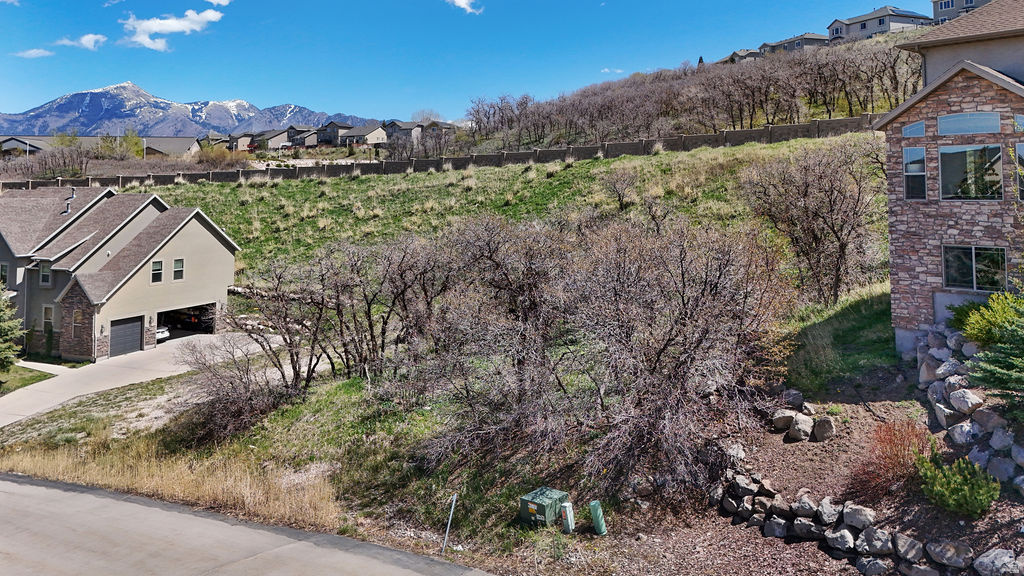 Incredible mountain view lot in the Suncrest Subdivision! Perfect opportunity to build your dream home in a peaceful, scenic setting with unbeatable views. The Geotechnical Engineering Review has already been completed on this lot along with house plans and HOA approval. However we are unsure if the approval has expired. Great opportunity to build.