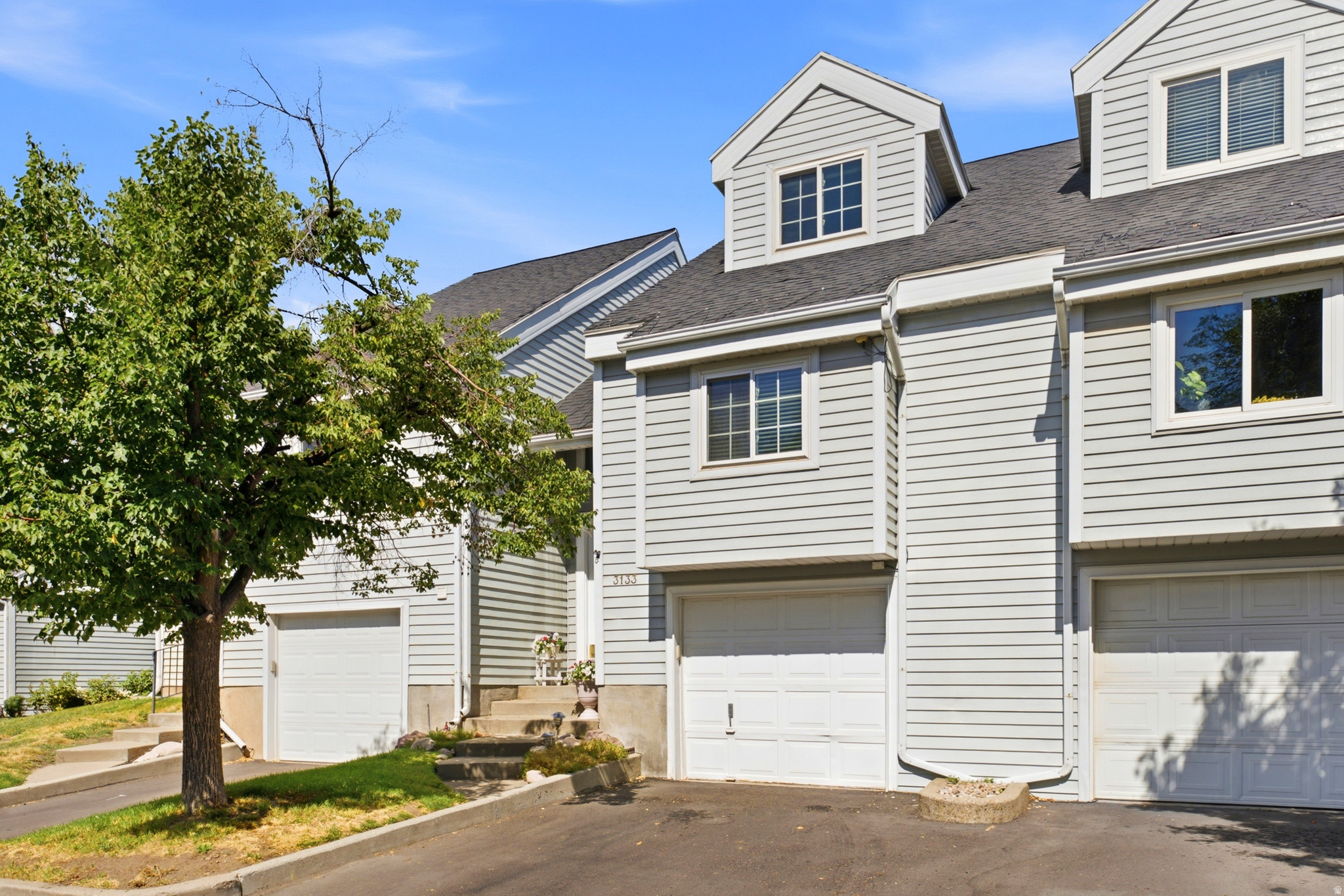 **OPEN HOUSE Saturday 7/11 from 11-1:30** __ Classy, clean, and convenient! Pride of ownership shines throughout this beautifully maintained Val Verda townhome featuring vaulted ceilings, a bright loft, cozy fireplace, and a flexible, functional layout. The newly remodeled kitchen boasts brand-new cabinets, LVP flooring, and all-new appliances. The layout offers two potential primary suites, with a bedroom and full bath on the main level and a spacious owner's suite with an adjoining bath upstairs. The finished lower level includes a large family room and a den/home office that could also be used as a fitness space or potential third bedroom. A spacious bathroom/laundry combo features a deep laundry sink, and the washer and dryer are included. Let's not forget the new water heater! Step outside to a newly built composite deck overlooking a cute, private backyard. This one is all about location, location, location! Situated between Salt Lake City and Ogden, with easy access to downtown Salt Lake City, the SLC airport, hiking trails, and the 455/470 bus routes, you can conveniently get wherever you need to go. Enjoy low-maintenance living with landscaping, snow removal, water, sewer, and trash covered by the HOA.