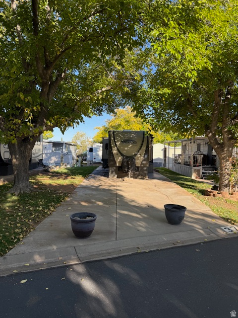Cool, convenient, and affordable, this shaded lot in Canyon Breeze RV comes with a ready-to-move-in Coachman trailer, privileges in a clubhouse with workout room and pool, and yard maintenance taken care of for you. Perfect as a live-in-now home, a second home, or as an investment that could generate rental income while your equity grows in the land underneath. Located right in the heart of the St George area with quick access to the area's services and attractions. Call for more information on the 50th Anniversary edition 2014 Coachman Freedom Express 30' Trailer with multiple pull-outs. Canyon Breeze RV is a 55+ and older community.
